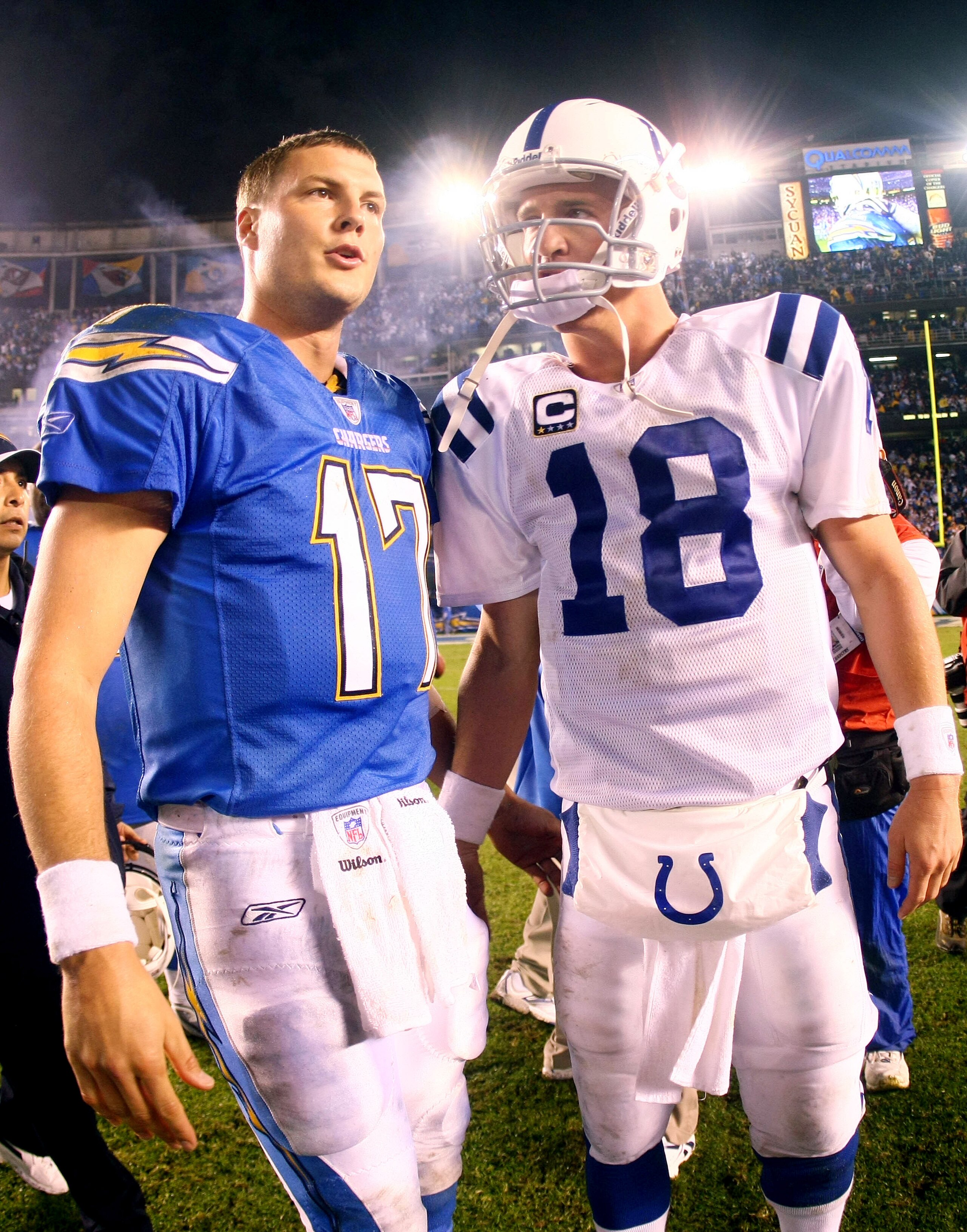 SAN DIEGO - NOVEMBER 11:  Quarterback Philip Rivers #17 of the San Diego Chargers meets Quarterback Peyton Manning #18 of the Indianapolis Colts during the Chargers 23-21 win over the Colts in the NFL game on November 11, 2007 at Qualcomm Stadium in San D