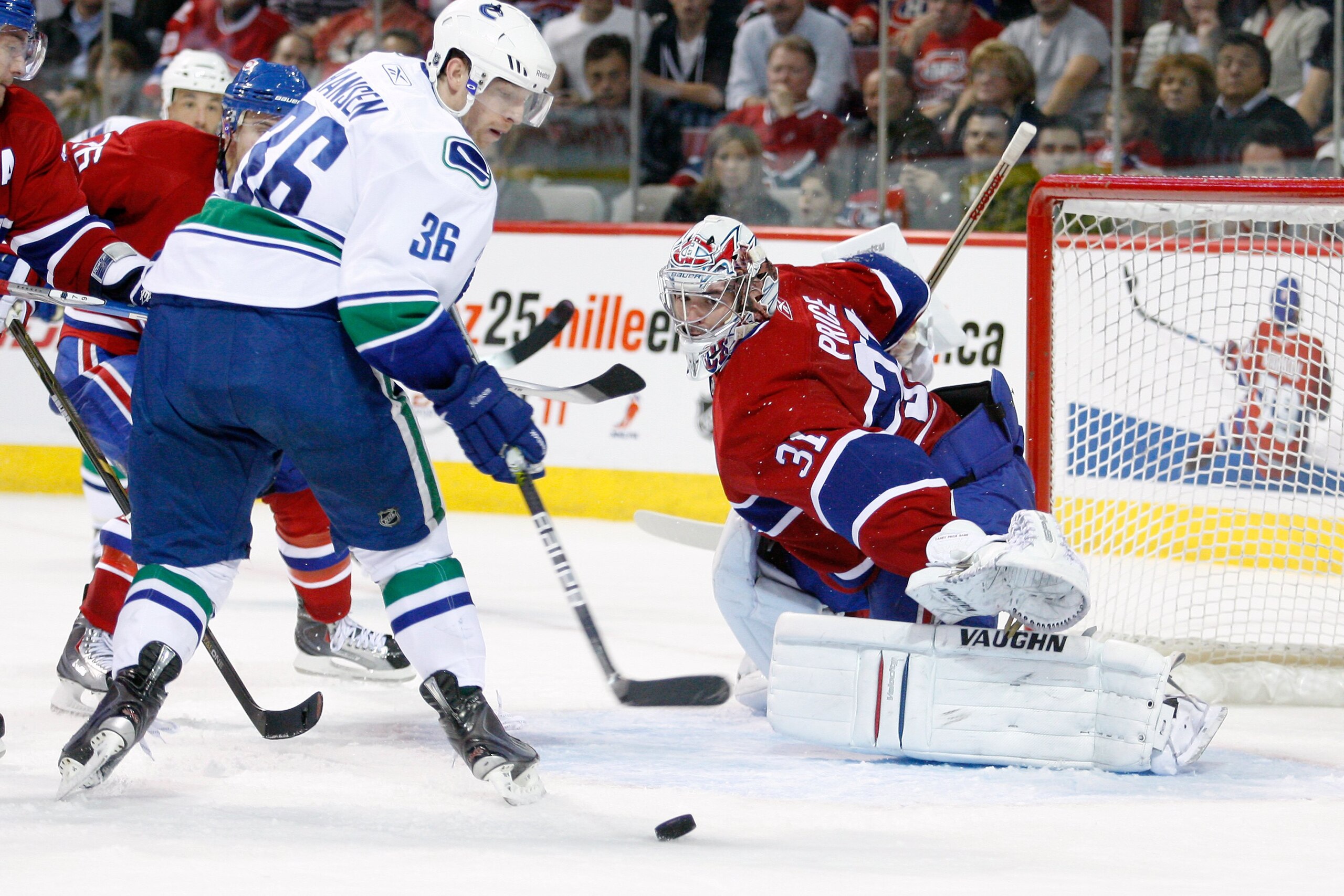 MONTREAL- NOVEMBER 9:   Carey Price #31 of the Montreal Canadiens watches the incoming puck on a shot by Jannik Hansen #36 of the Vancouver Canucks during the NHL game against the Montreal Canadiens at the Bell Centre on November 9, 2010 in Montreal, Queb