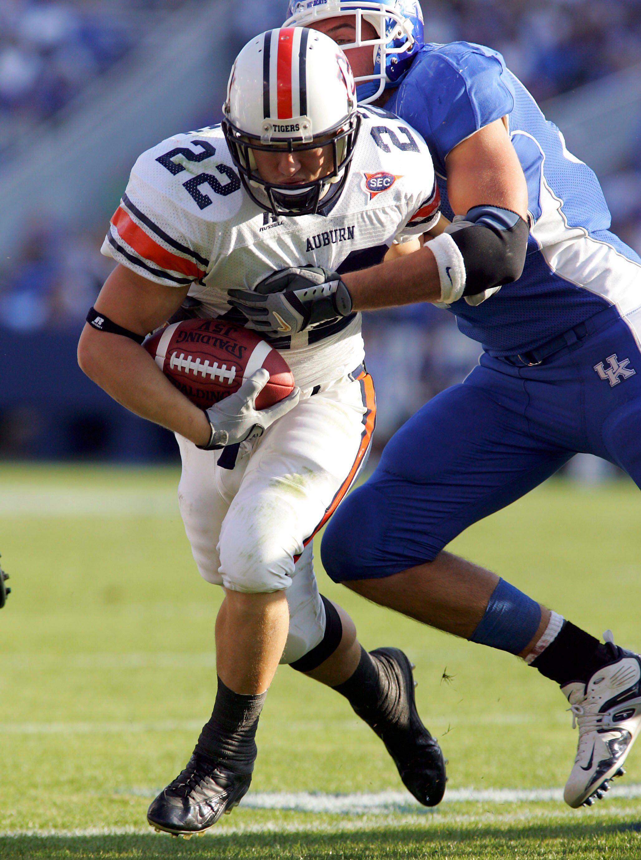 LEXINGTON, KY - NOVEMBER 5:   Tre Smith #23 of the Auburn Tigers runs with the ball while dragging a   Kentucky Wildcats with him on November  5, 2005 at Commonwealth Stadium in Lexington, Kentucky.  (Photo by Andy Lyons/Getty Images)