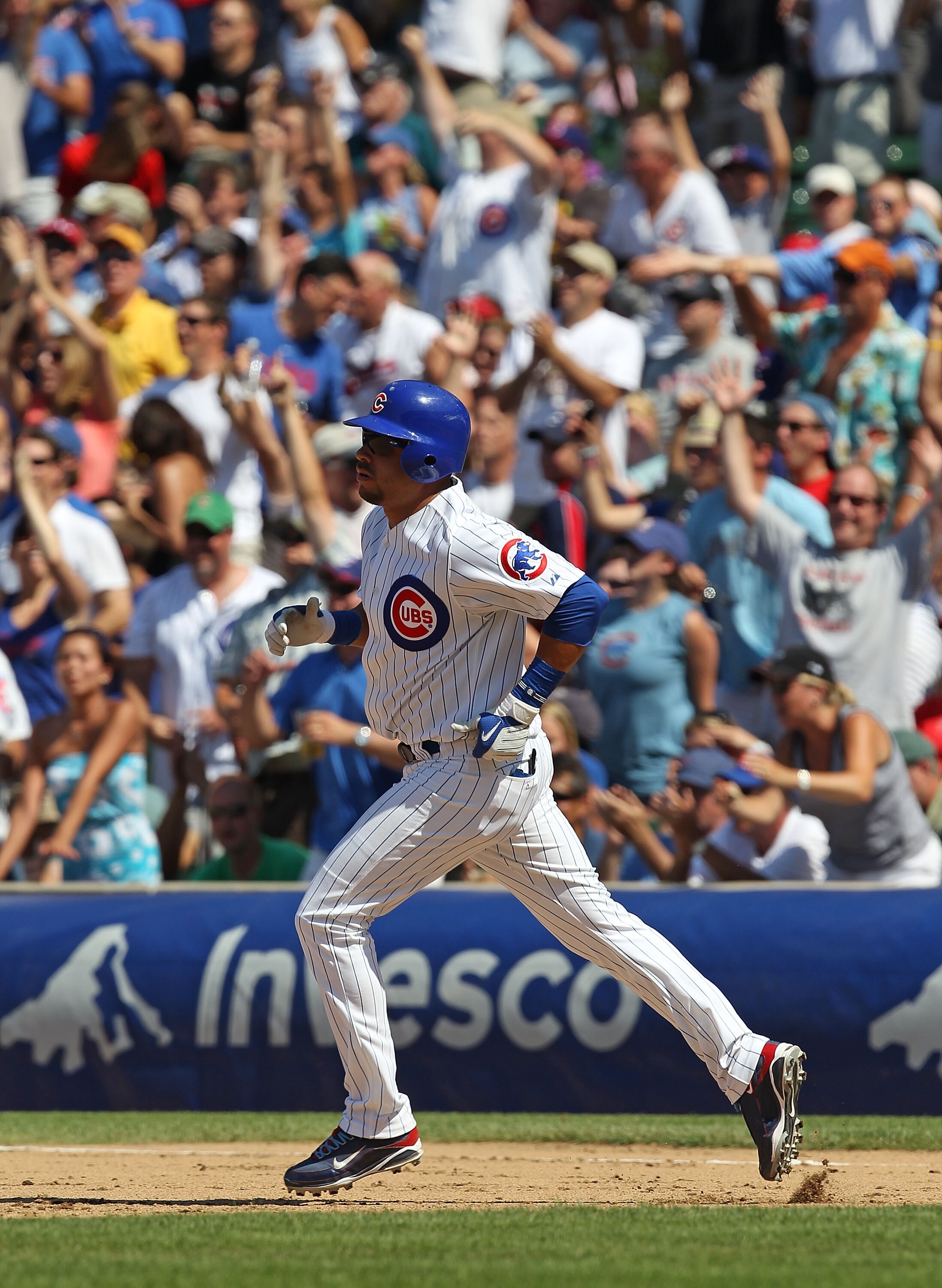 CHICAGO - JULY 16: Aramis Ramirez #16 of the Chicago Cubs runs the bases after hitting the game-winning home run, a solo shot in the 8th inning, against the Philadelphia Phillies at Wrigley Field on July 16, 2010 in Chicago, Illinois. The Cubs defeated th
