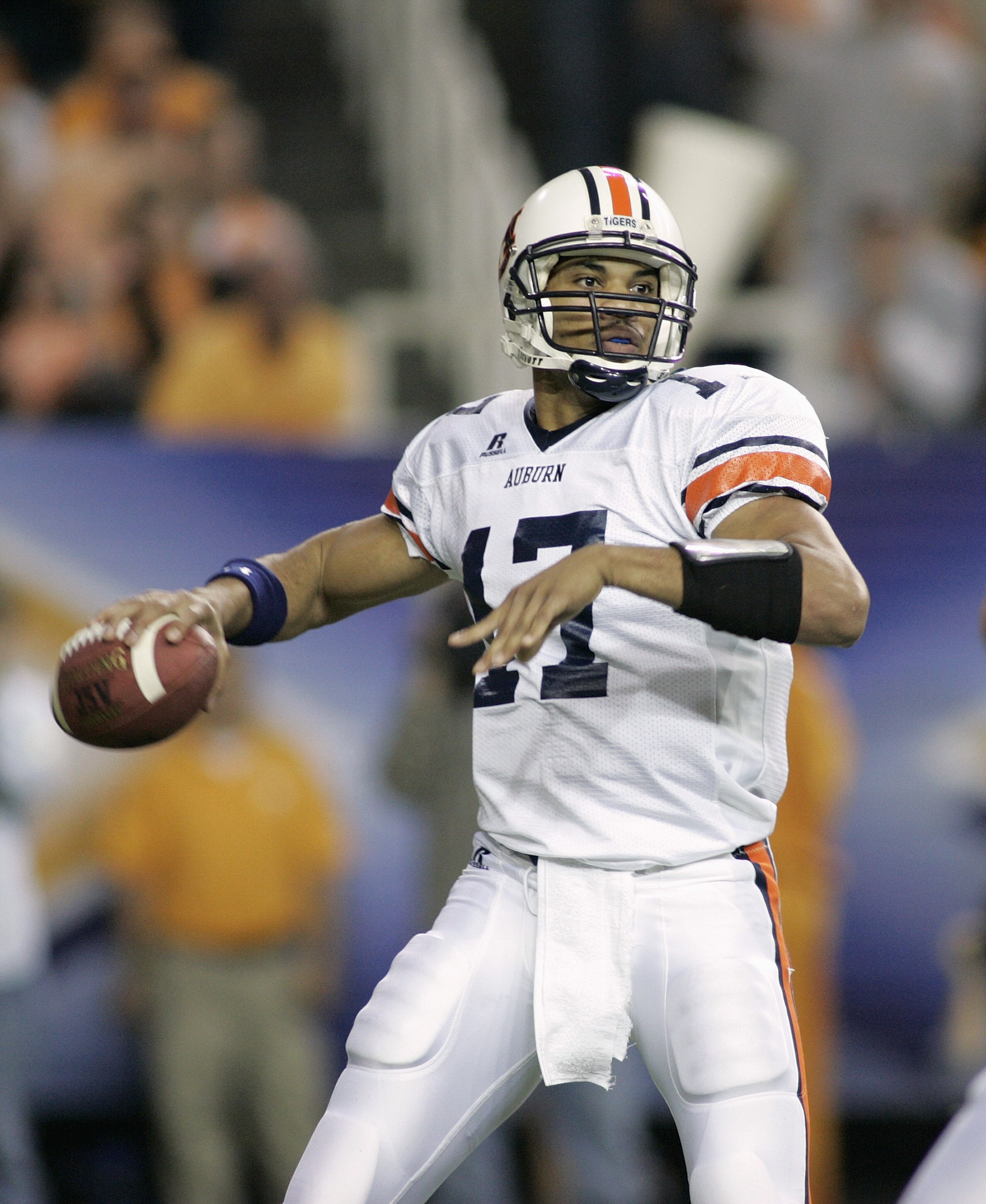 ATLANTA, GA - DECEMBER 4:  Quarterback Jason Campbell #17 of the Auburn Tigers looks to pass against defensive end Parys Haralson #98 and the Tennessee Volunteers during the 2004 SEC Championship Game at the Georgia Dome on December 4, 2004 in Atlanta, Ge