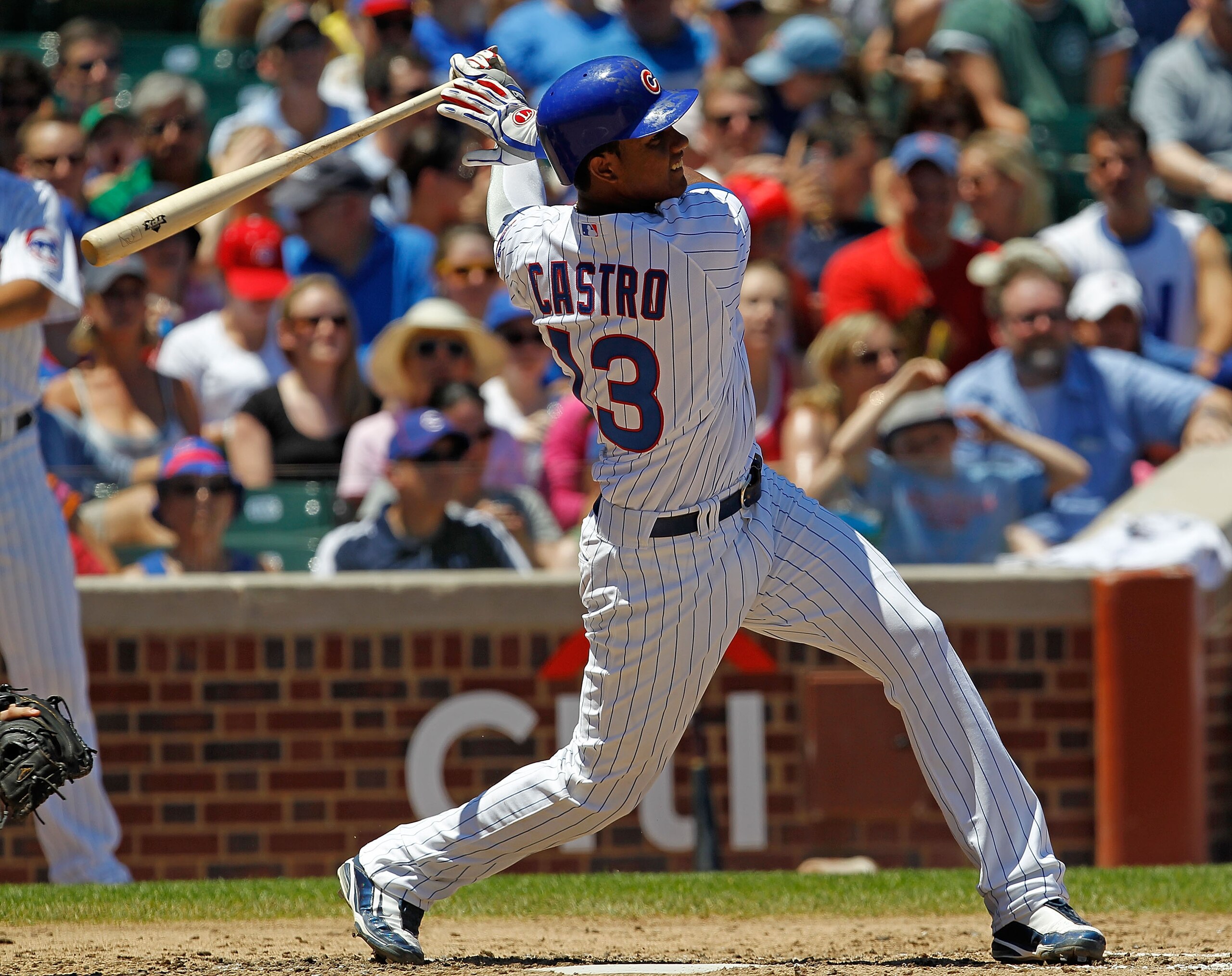 CHICAGO - JULY 03: Starlin Castro #13 of the Chicago Cubs takes a swing against the Cincinnati Reds at Wrigley Field on July 3, 2010 in Chicago, Illinois. The Cubs defeated the Reds 3-1. (Photo by Jonathan Daniel/Getty Images)