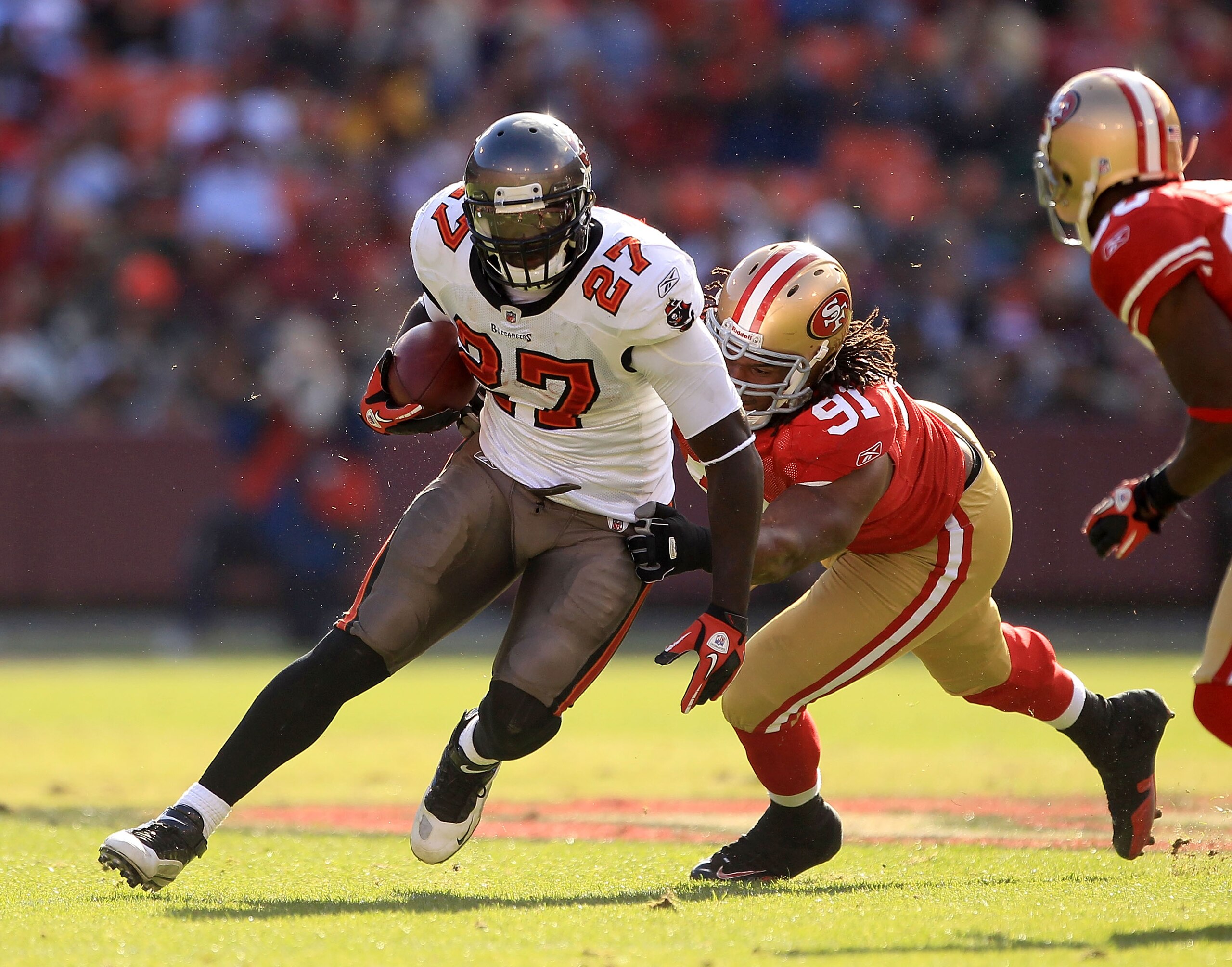 SAN FRANCISCO - NOVEMBER 21: LeGarrette Blount #27 of the Tampa Bay Buccaneers is tackled by the Ray McDonald #91 of the San Francisco 49ers at Candlestick Park on November 21, 2010 in San Francisco, California. (Photo by Ezra Shaw/Getty Images) SAN FRANCISCO - NOVEMBER 21: LeGarrette Blount #27 of the Tampa Bay Buccaneers is tackled by the Ray McDonald #91 of the San Francisco 49ers at Candlestick Park on November 21, 2010 in San Francisco, California. (Photo by Ezra Shaw/Getty Images)