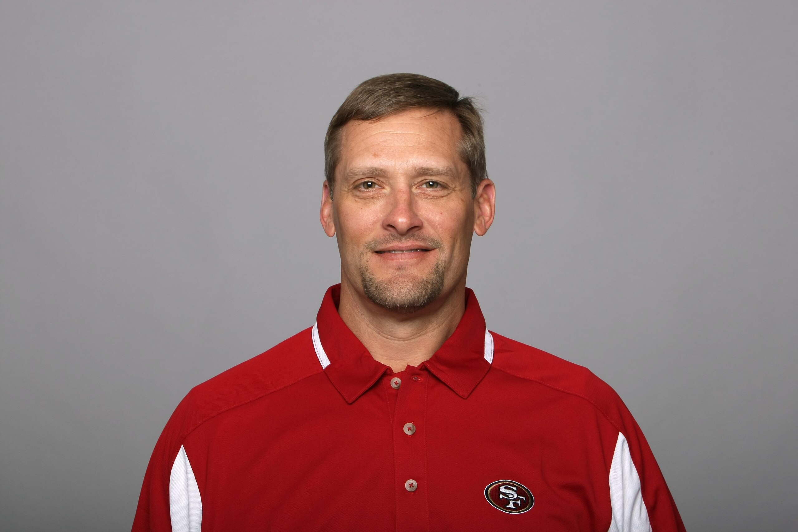 SAN FRANCISCO - 2009:  Tom Rathman of the San Francisco 49ers poses for his 2009 NFL headshot at photo day in San Francisco, California.  (Photo by NFL Photos)