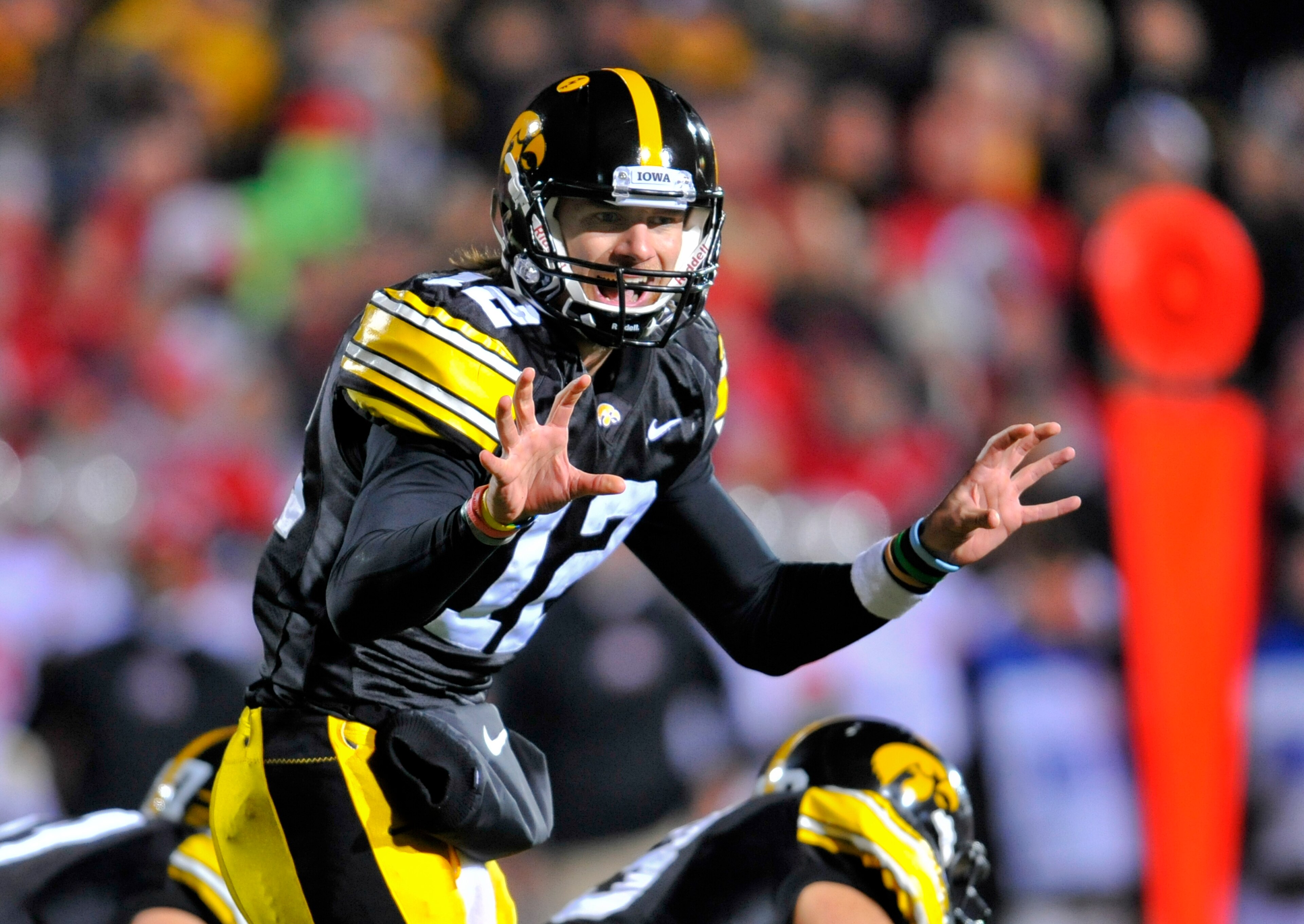 IOWA CITY, IA - NOVEMBER 20: Quarterback Ricky Stanzi #12 of the University of Iowa Hawkeyes signals a call at the line during second half action against the Ohio State Buckeyes at Kinnick Stadium on November 20, 2010 in Iowa City, Iowa. Ohio State won 2 IOWA CITY, IA - NOVEMBER 20: Quarterback Ricky Stanzi #12 of the University of Iowa Hawkeyes signals a call at the line during second half action against the Ohio State Buckeyes at Kinnick Stadium on November 20, 2010 in Iowa City, Iowa. Ohio State won 2