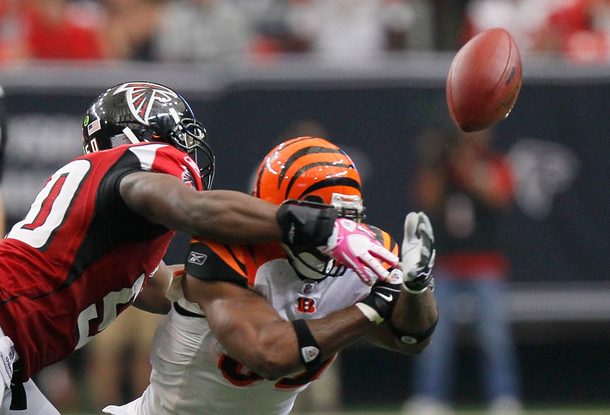 ATLANTA - OCTOBER 24:  Cedric Benson #32 of the Cincinnati Bengals fumbles the ball against Curtis Lofton #50 of the Atlanta Falcons at Georgia Dome on October 24, 2010 in Atlanta, Georgia.  (Photo by Kevin C. Cox/Getty Images)