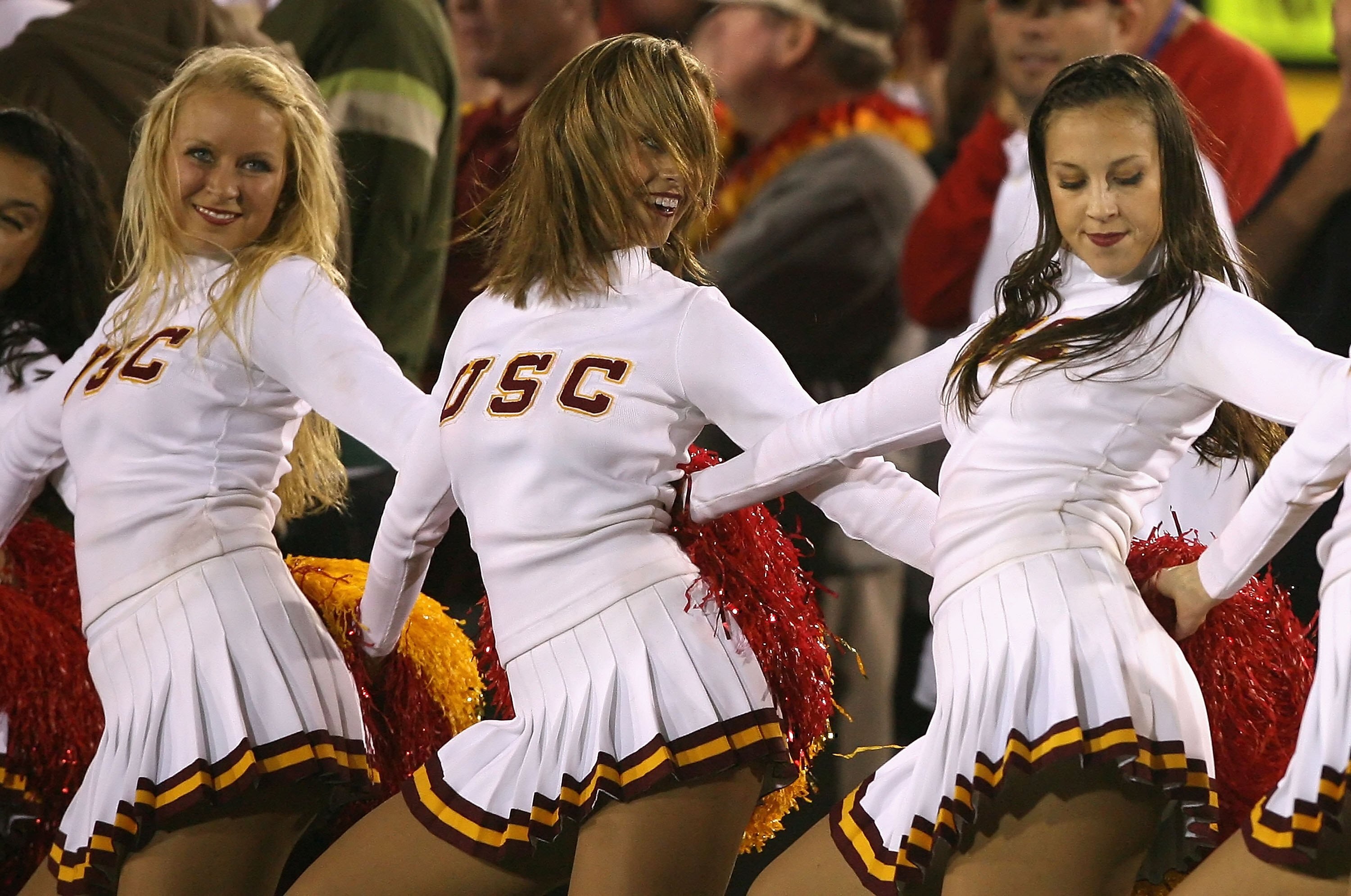 LOS ANGELES, CA - NOVEMBER 03:  The USC Trojans song girls, (L-R) Sara, Jenny and Diana perform during the college football game against the Oregon State Beavers at the Los Angeles Memorial Coliseum on November 3, 2007 in Los Angeles, California. USC defe