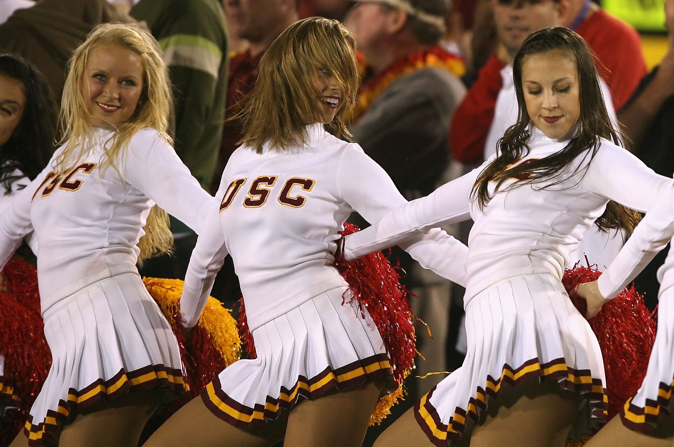 LOS ANGELES, CA - NOVEMBER 03:  The USC Trojans song girls, (L-R) Sara, Jenny and Diana perform during the college football game against the Oregon State Beavers at the Los Angeles Memorial Coliseum on November 3, 2007 in Los Angeles, California. USC defe