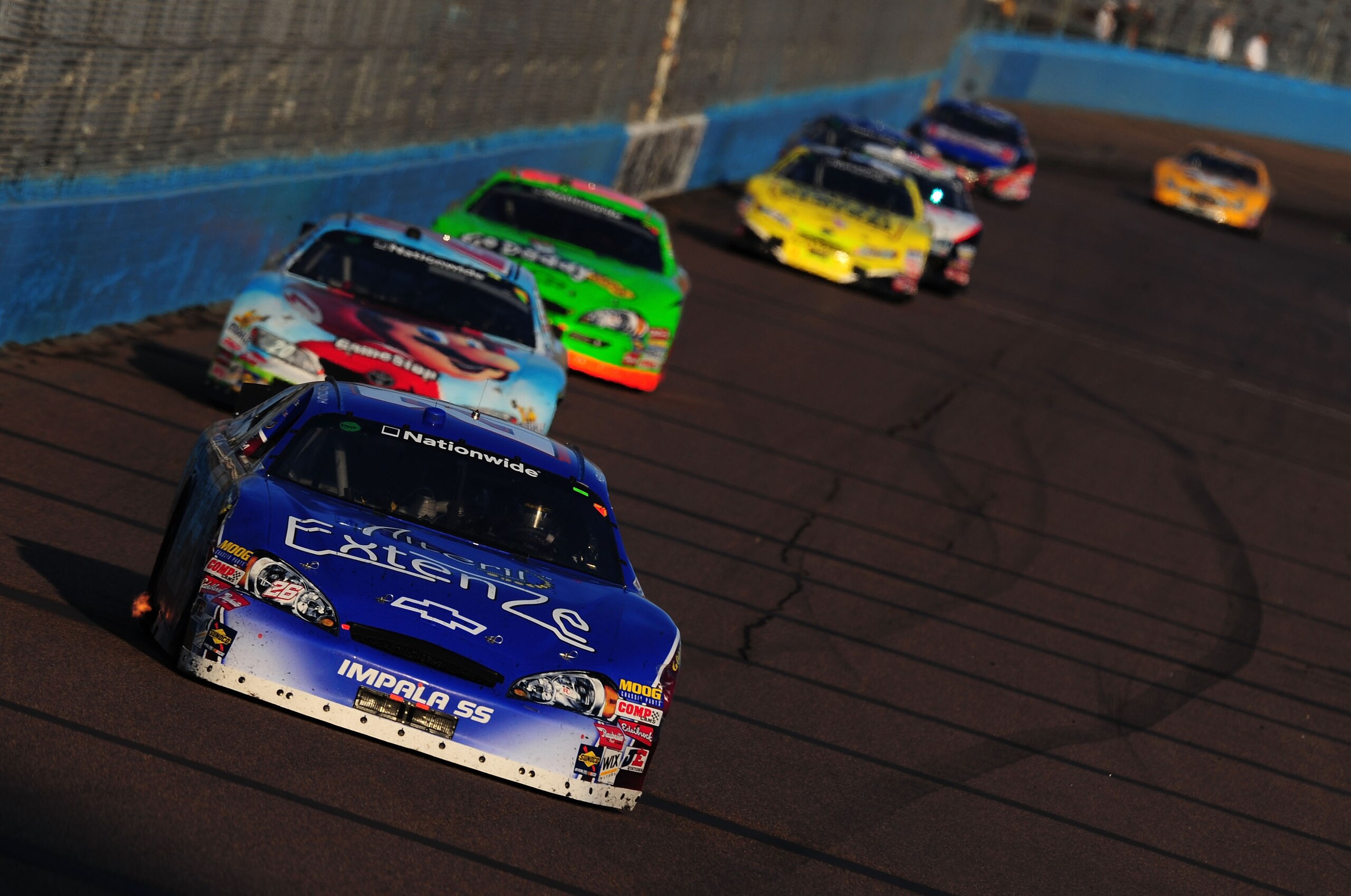 AVONDALE, AZ - NOVEMBER 14:  Kevin Conway driver of the #26 Extenze Ford leads a pack of cars during the NASCAR Nationwide Series Able Body Labor 200 at Phoenix International Raceway on November 14, 2009 in Avondale, Arizona.  (Photo by Robert Laberge/Get