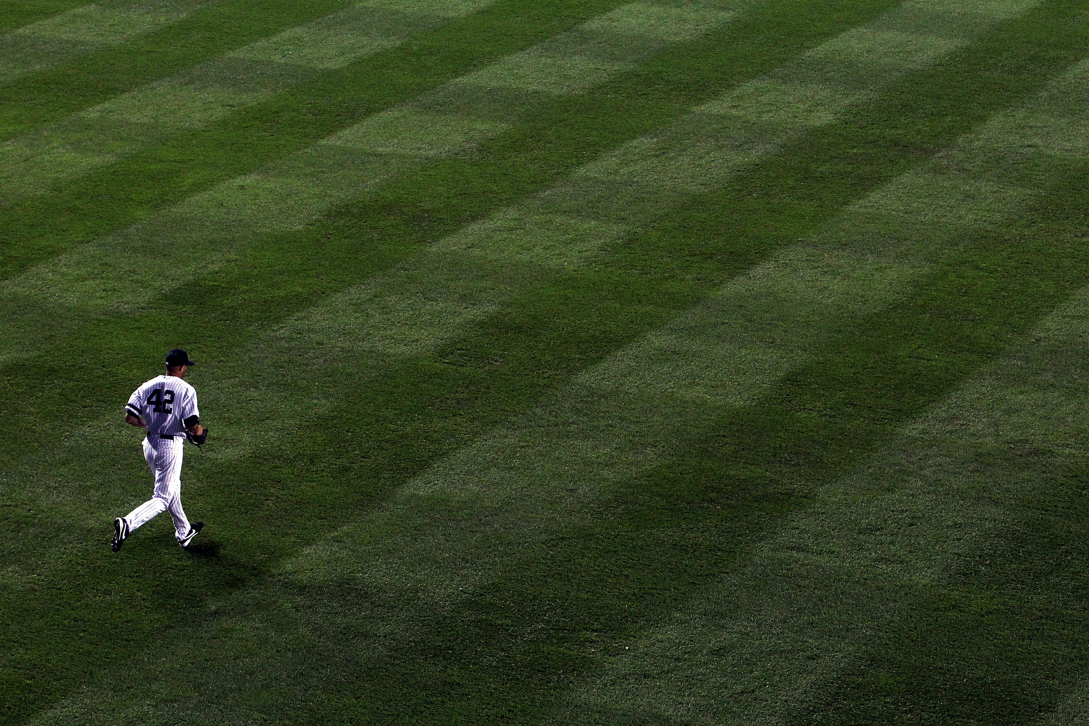 NEW YORK - OCTOBER 20:  Mariano Rivera #42 of the New York Yankees runs out of the bullpen onto the field to pitch against the Texas Rangers in Game Five of the ALCS during the 2010 MLB Playoffs at Yankee Stadium on October 20, 2010 in the Bronx borough o