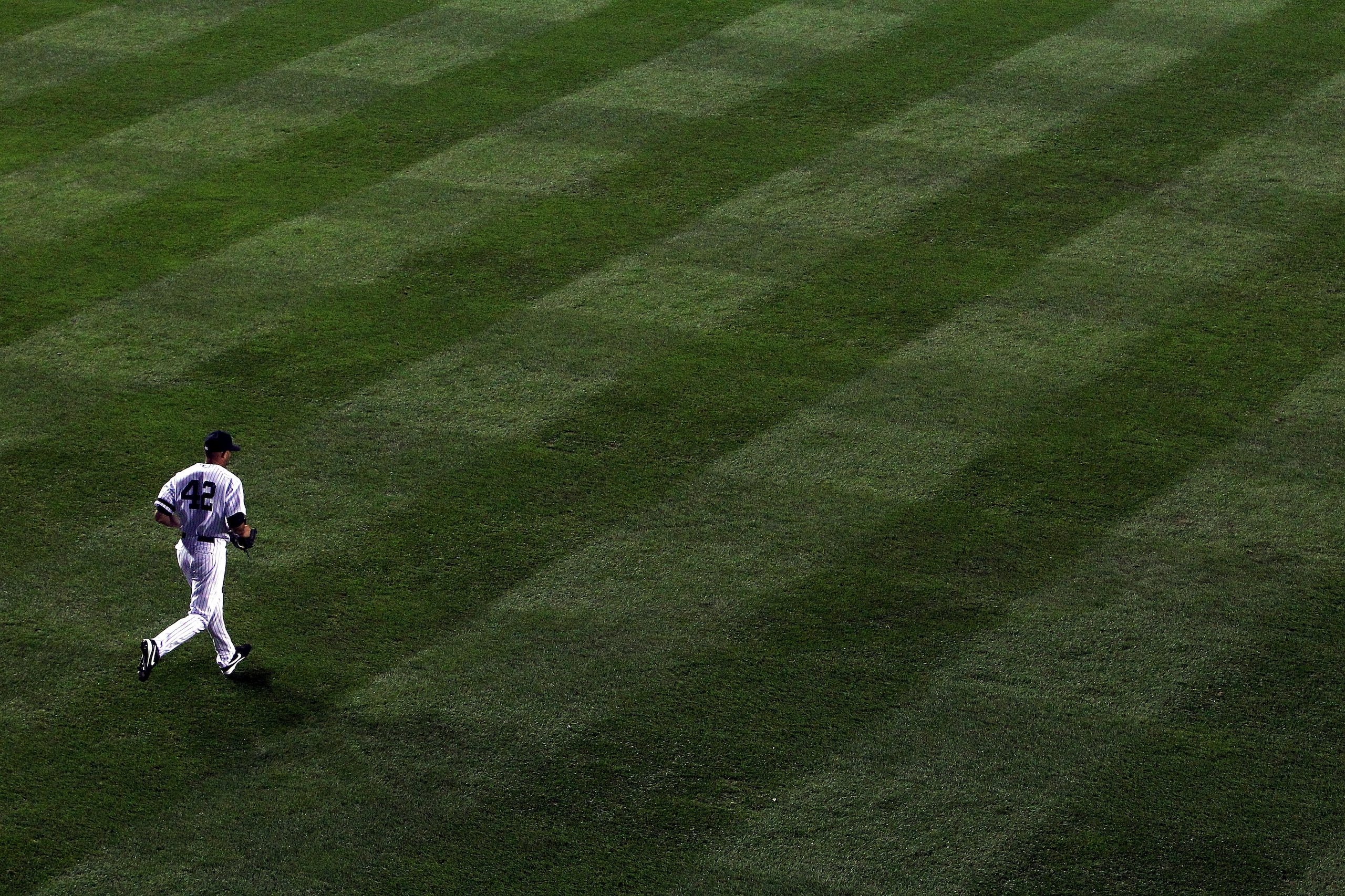 NEW YORK - OCTOBER 20:  Mariano Rivera #42 of the New York Yankees runs out of the bullpen onto the field to pitch against the Texas Rangers in Game Five of the ALCS during the 2010 MLB Playoffs at Yankee Stadium on October 20, 2010 in the Bronx borough o