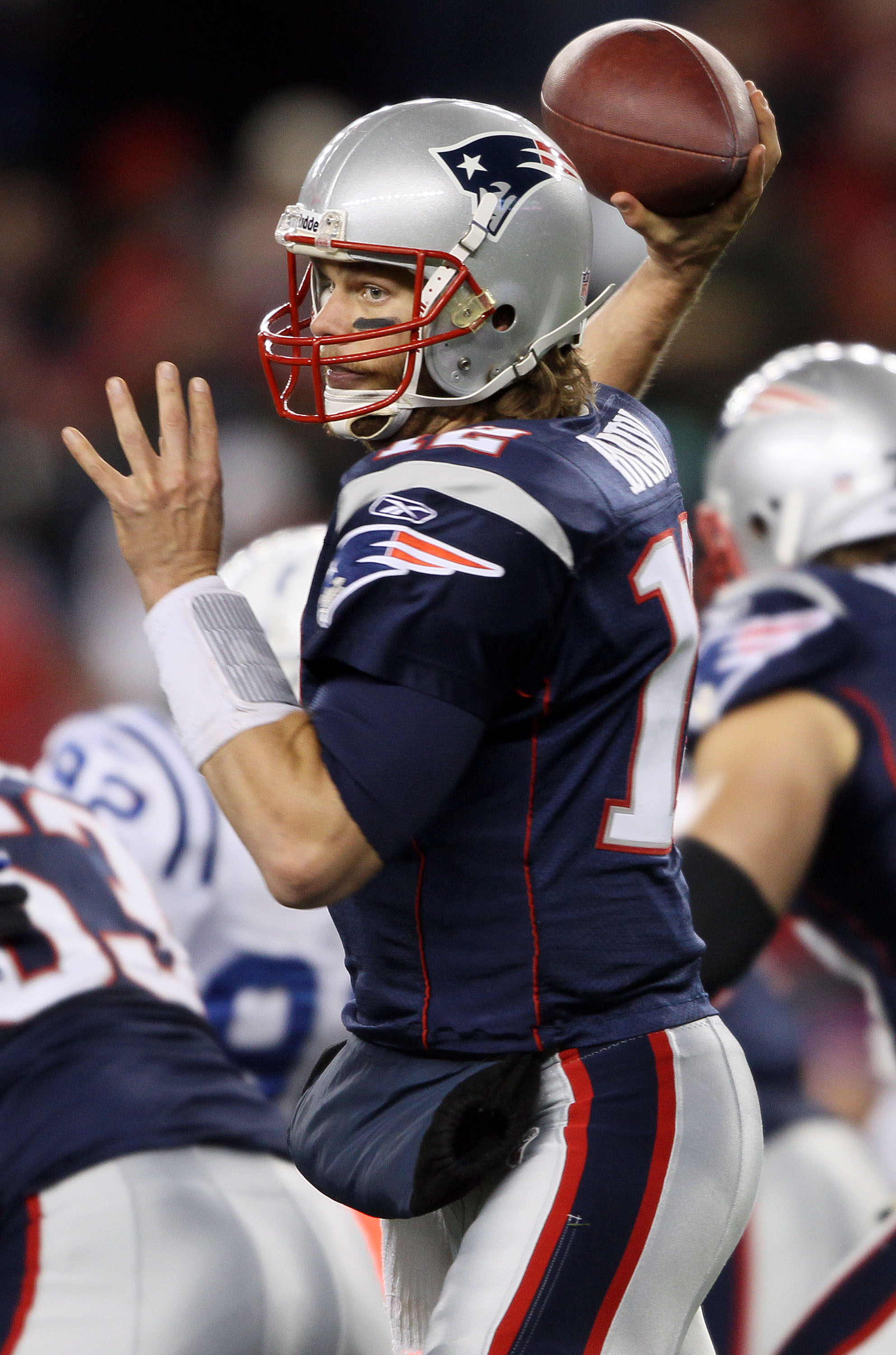 FOXBORO, MA - NOVEMBER 21:   Tom Brady #12 of the New England Patriots passes the ball in the third quarter against the Indianapolis Colts on November 21, 2010 at Gillette Stadium in Foxboro, Massachusetts. (Photo by Elsa/Getty Images)