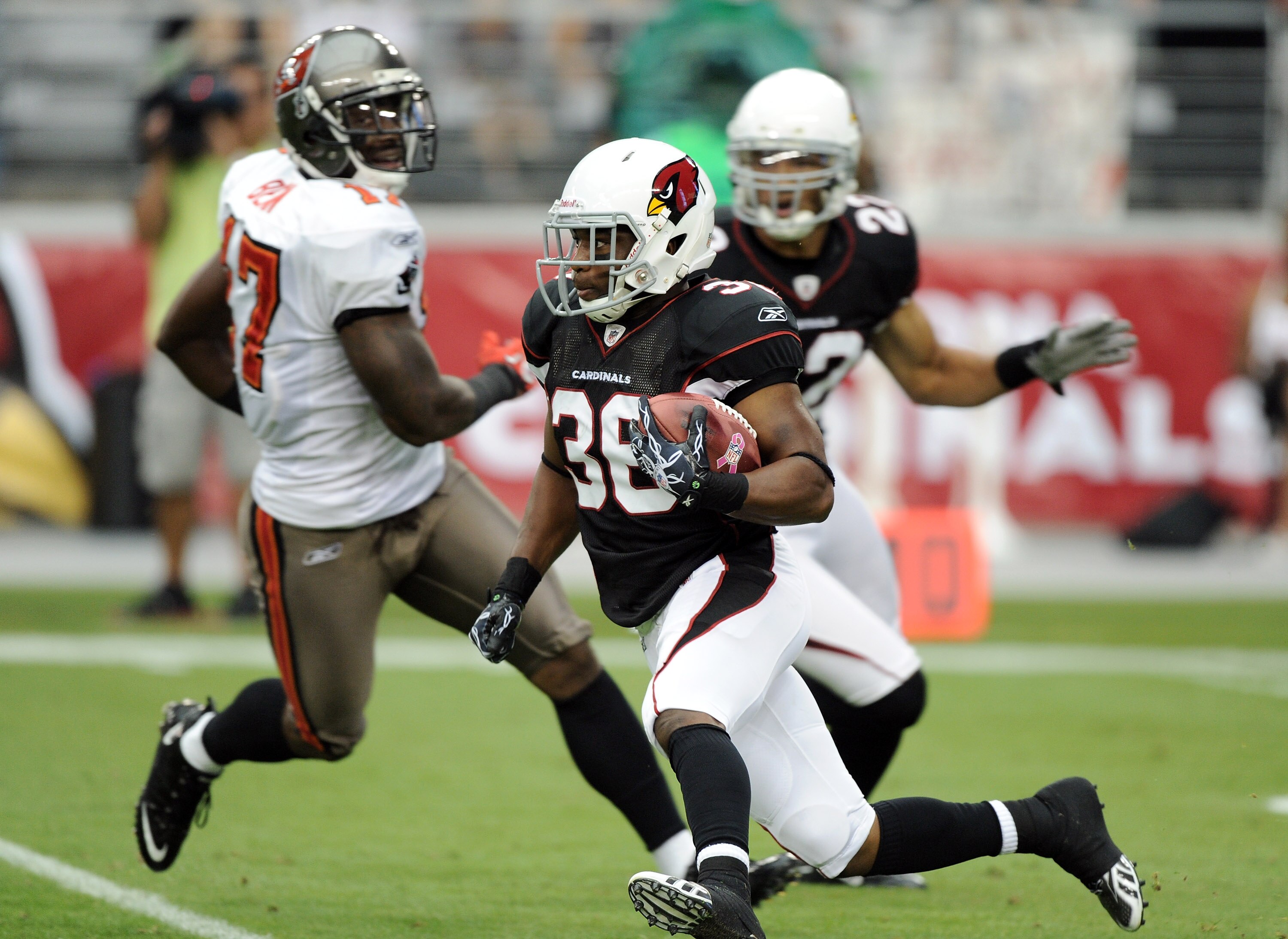 GLENDALE, AZ - OCTOBER 31:  LaRod Stephens-Howling #36 of the Arizona Cardinals cuts back in front of Matt Ware #22 and Arrelious Benn #17 of the Tampa Bay Buccaneers at University of Phoenix Stadium on October 31, 2010 in Glendale, Arizona.  (Photo by Ha