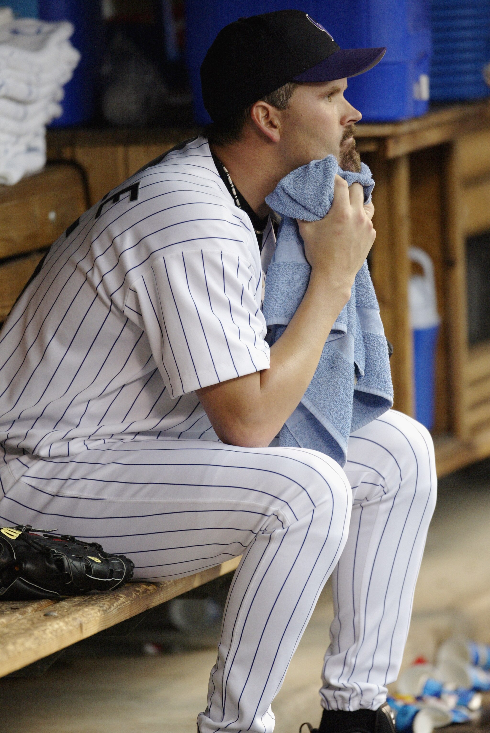 DENVER - JUNE 17:  Starting pitcher Denny Neagle #15 of the Colorado Rockies watches the game from the dugout in the bottom half of the first inning of the game against the San Diego Padres at Coors Field on June 17, 2003 in Denver, Colorado.  The Padres