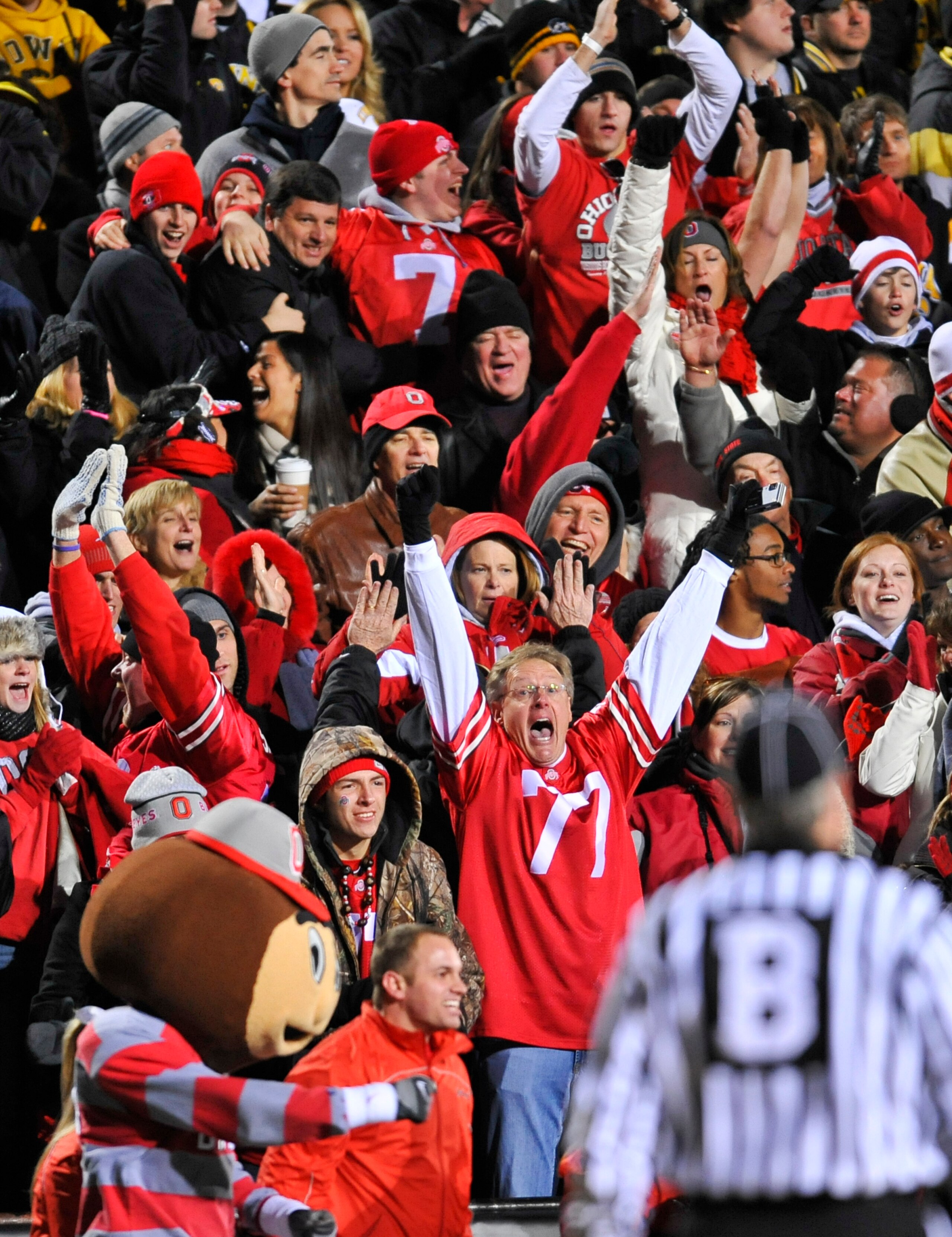 IOWA CITY, IA - NOVEMBER 20: Ohio State fans cheer on their teams as they take on the University of Iowa Hawkeyes at Kinnick Stadium on November 20, 2010 in Iowa City, Iowa. Ohio State won 20-17 over Iowa. (Photo by David Purdy/Getty Images).