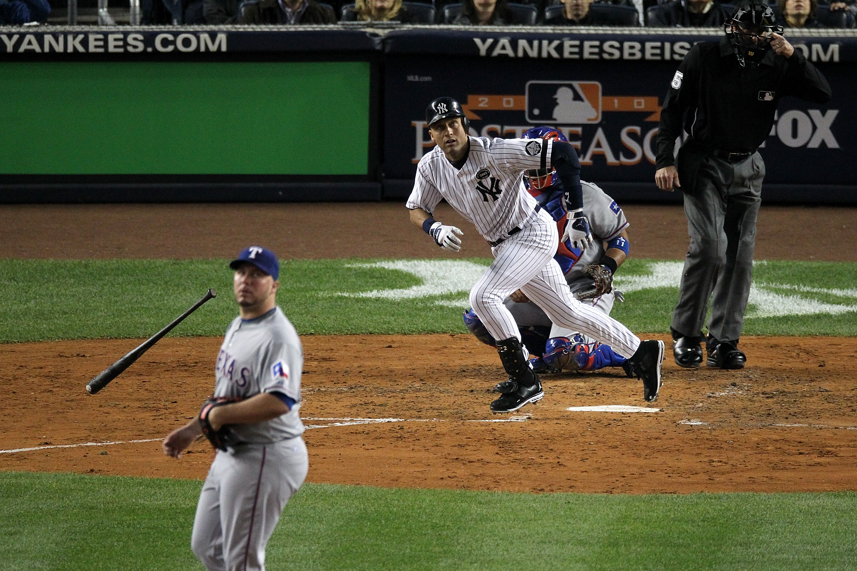 NEW YORK - OCTOBER 19:  Derek Jeter #2 of the New York Yankees hits a triple in the third inning against Tommy Hunter #35 of the Texas Rangers in Game Four of the ALCS during the 2010 MLB Playoffs at Yankee Stadium on October 19, 2010 in the Bronx borough