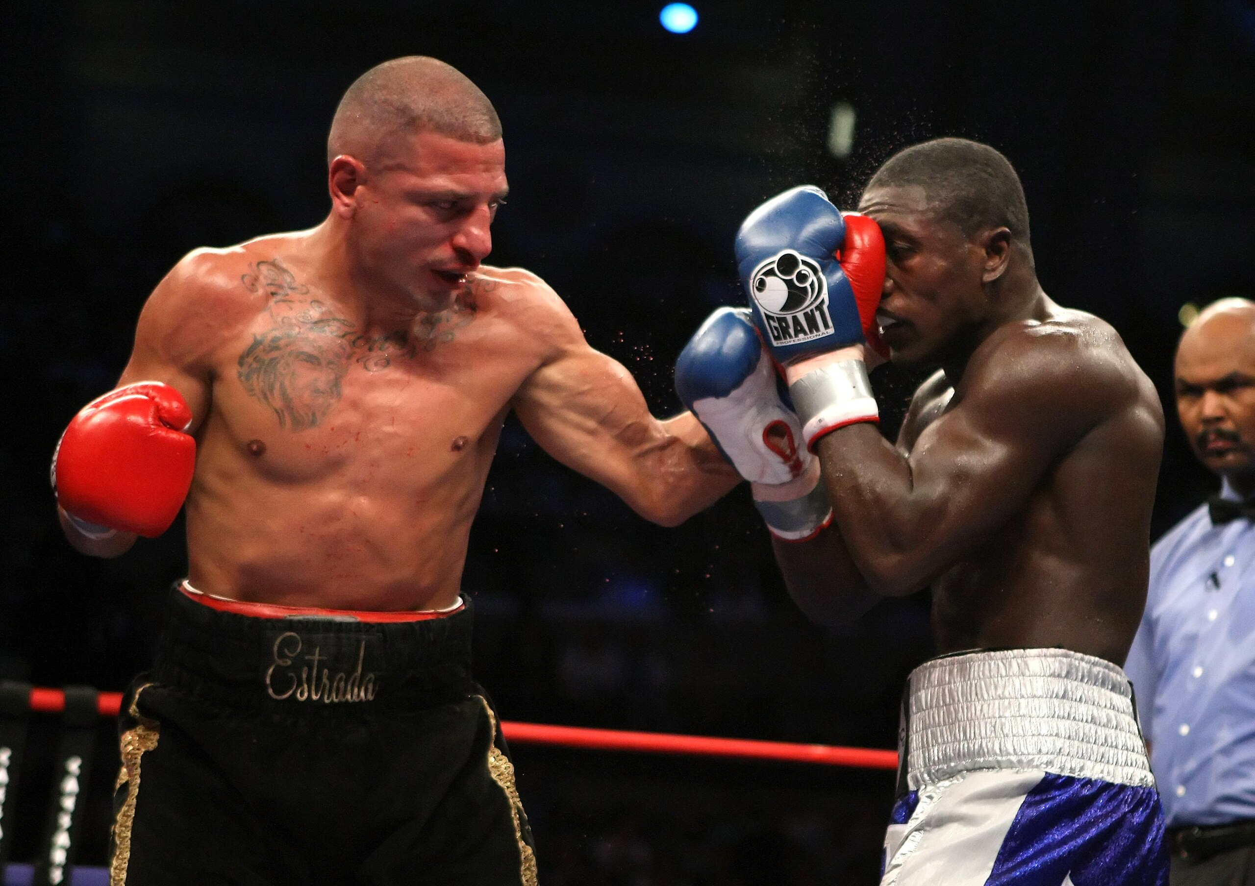 ATLANTIC CITY, NJ - SEPTEMBER 29:  David Estrada lands a left hand hook against Andre Berto during their NABF Welterweight Championship fight at Boardwalk Hall on September 29, 2007 in Atlantic City, New Jersey.  (Photo by Al Bello/Getty Images)