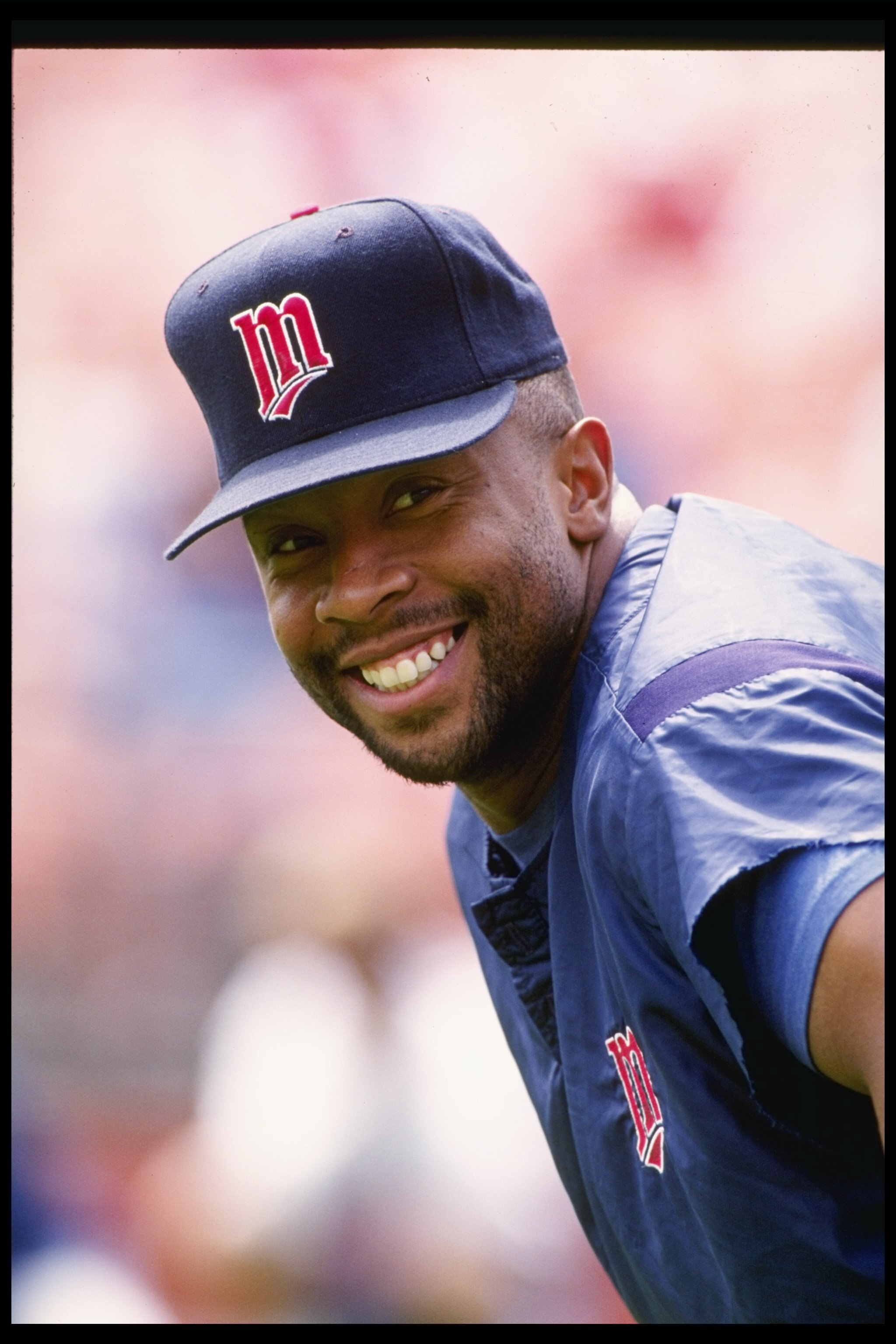 25 Jul 1992:  Outfielder Kirby Puckett of the Minnesota Twins smiles at the camera during a game against the Oakland Athletics at Oakland Alameda County Coliseum in Oakland, California.  Mandatory Credit: Otto Greule Jr.  /Allsport