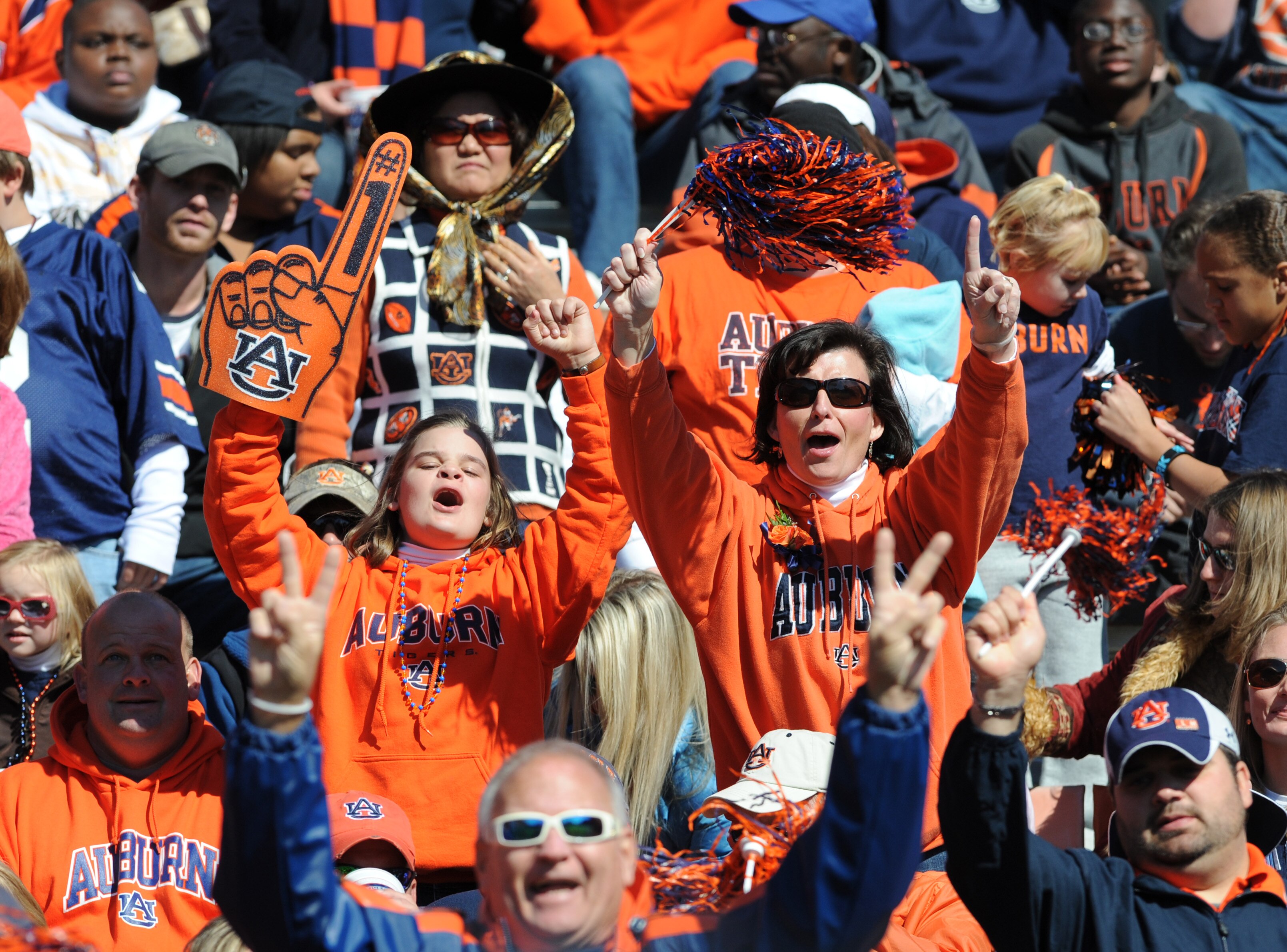 AUBURN, AL - NOVEMBER 06:  Fans of the Auburn Tigers cheer play against the Chattanooga Mocs November 6, 2010 at Jordan-Hare Stadium in Auburn, Alabama.  (Photo by Al Messerschmidt/Getty Images)