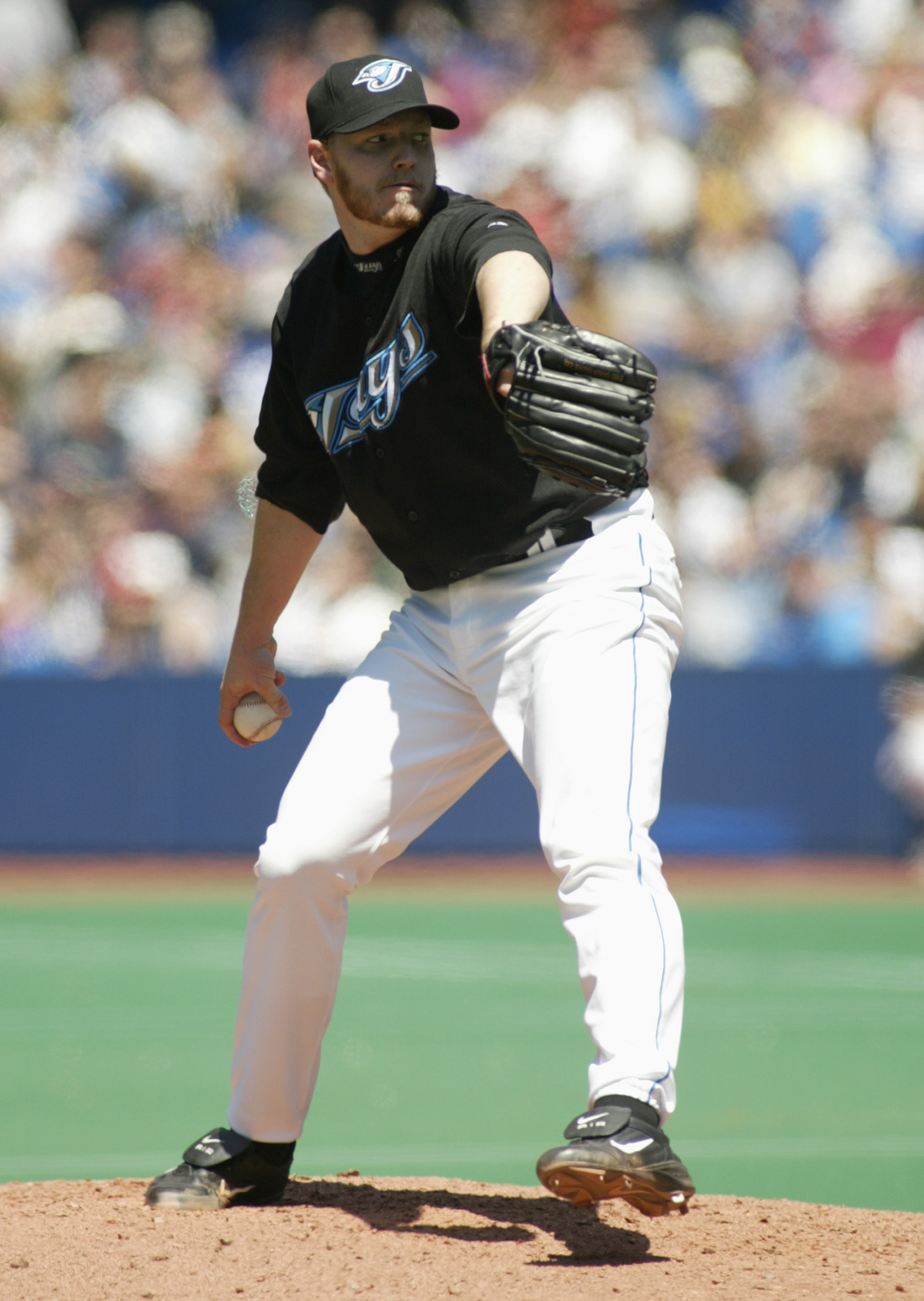TORONTO - MAY 16:  Roy Hallyday #32 of the Toronto Blue Jays pitches against the Boston Red Sox during the game on May 16, 2004 at Skydome in Toronto, Ontario, Canada.  The Blue Jays won 3-1.  (Photo by Rick Stewart/Getty Images)