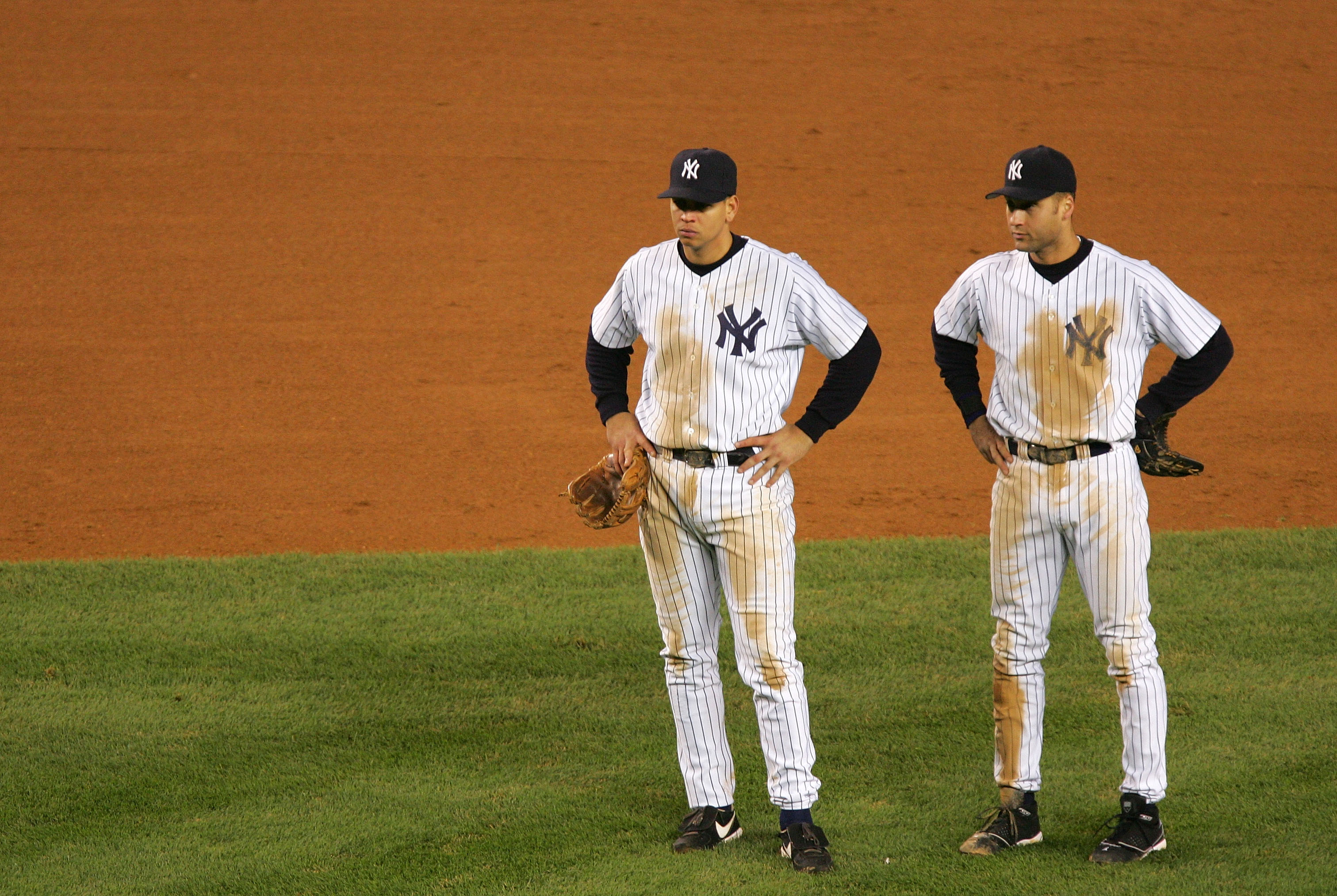 NEW YORK - OCTOBER 20:  Alex Rodriguez #13 and Derek Jeter #2 of the New York Yankees watch during a pitching change in the seventh inning against the Boston Red Sox during game seven of the American League Championship Series on October 20, 2004 at Yanke