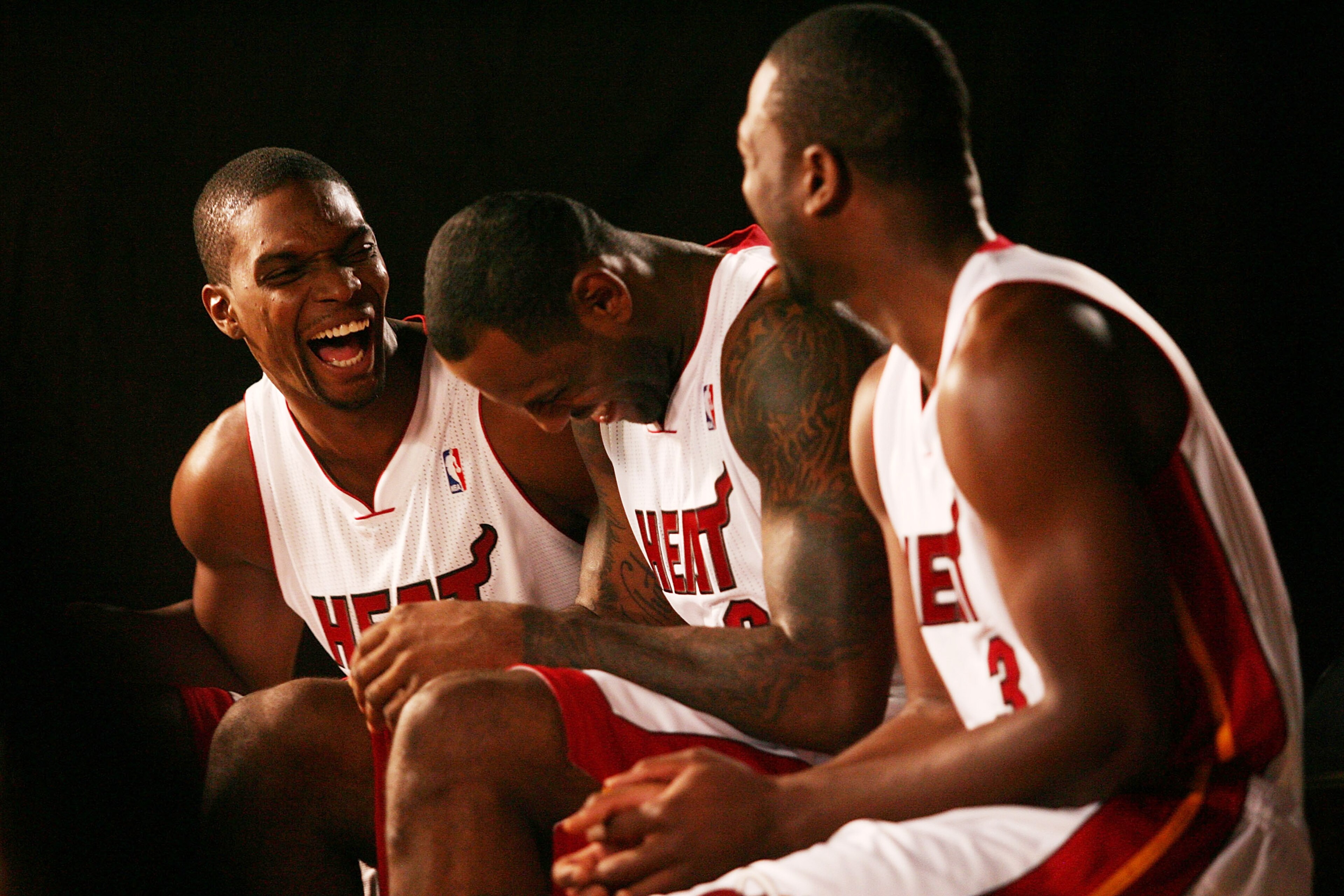 MIAMI - SEPTEMBER 27:  (L-R) Chris Bosh, LeBron James and Dwyane Wade of the Miami Heat answers questions during media day at the Bank United Center on September 27, 2010 in Miami, Florida.  (Photo by Marc Serota/Getty Images)