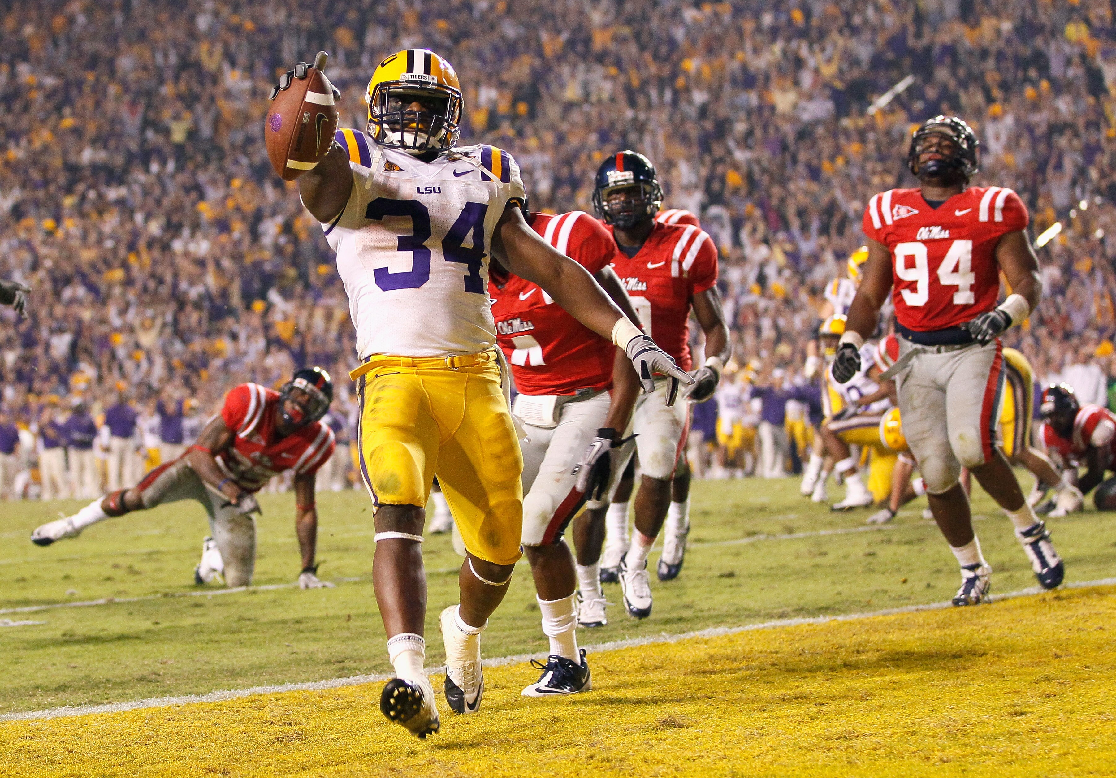 BATON ROUGE, LA - NOVEMBER 20:  Stevan Ridley #34 of the Louisiana State University Tigers scores the go-ahead toucdown in the final minutes of the fourth quarter against the Ole Miss Rebels at Tiger Stadium on November 20, 2010 in Baton Rouge, Louisiana.