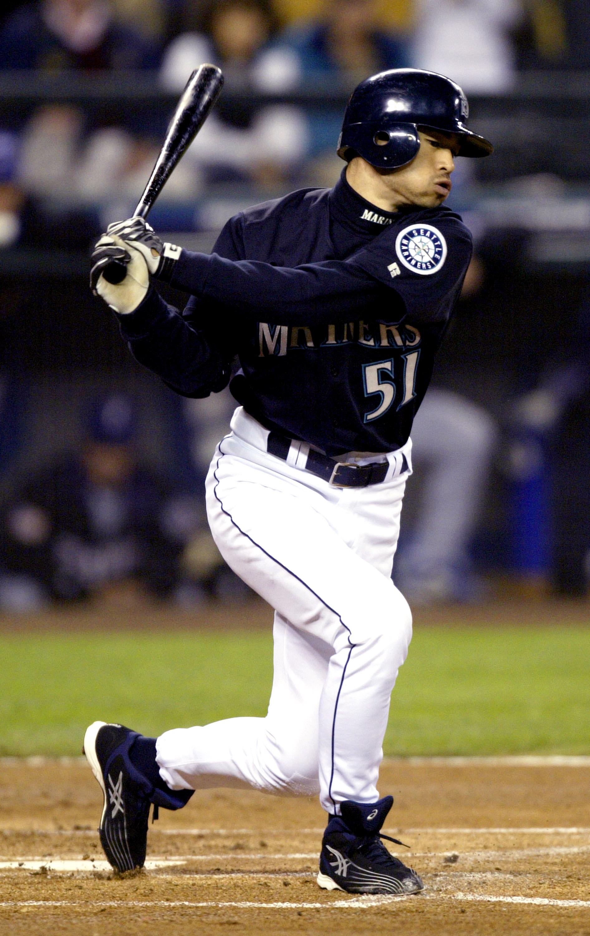 SEATTLE - OCTOBER 1:  Outfielder Ichiro Suzuki #51 of the Seattle Mariners connects with a Texas Rangers pitch and ties George Sisler's 84-year-old record for hits in a single season, during the game on October 1, 2004 at Safeco Field in Seattle, Washingt