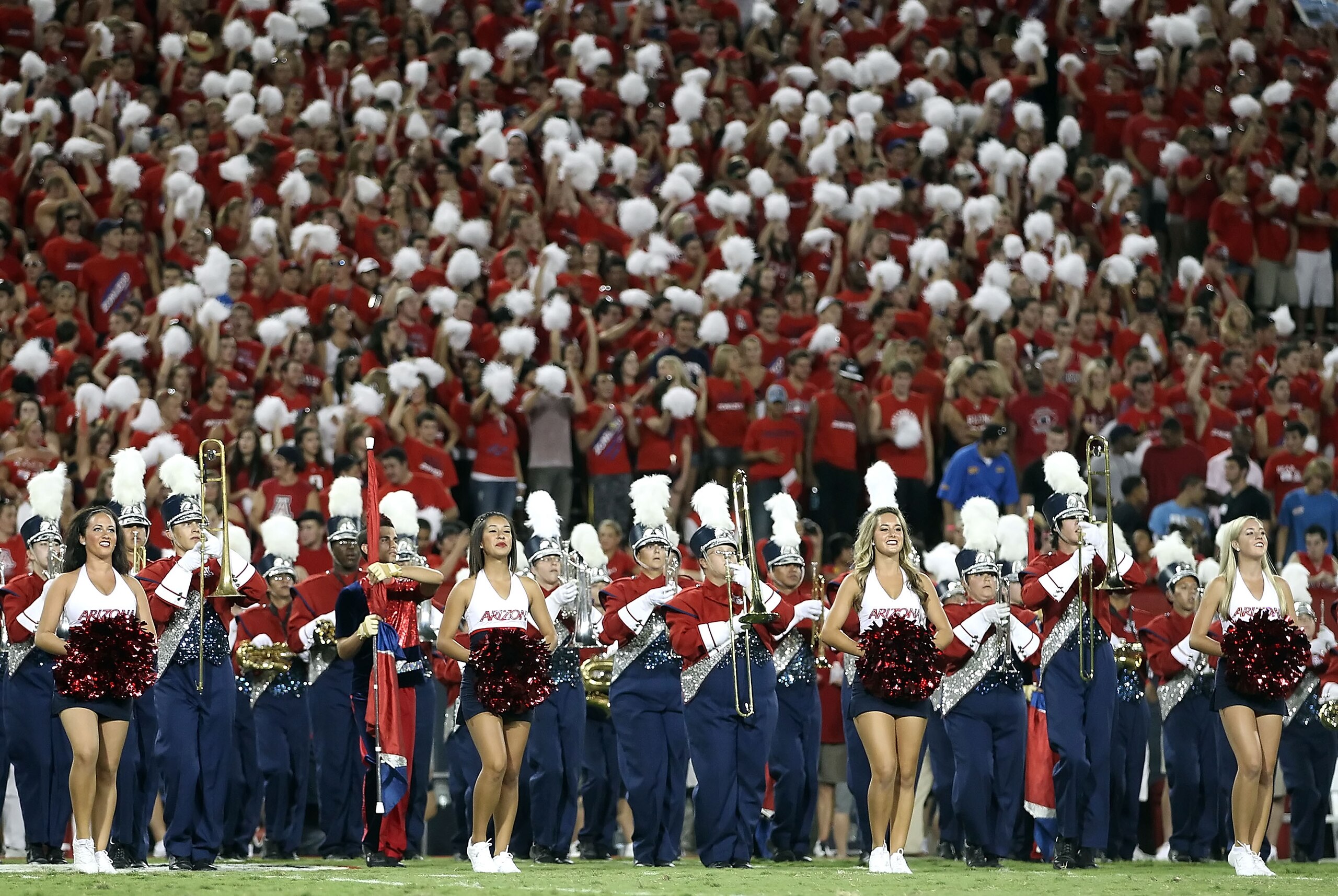 TUCSON, AZ - SEPTEMBER 18: The Arizona Wildcats cheerleaders and band perform before the college football game against the Iowa Hawkeyes at Arizona Stadium on September 18, 2010 in Tucson, Arizona. (Photo by Christian Petersen/Getty Images) TUCSON, AZ - SEPTEMBER 18: The Arizona Wildcats cheerleaders and band perform before the college football game against the Iowa Hawkeyes at Arizona Stadium on September 18, 2010 in Tucson, Arizona. (Photo by Christian Petersen/Getty Images)