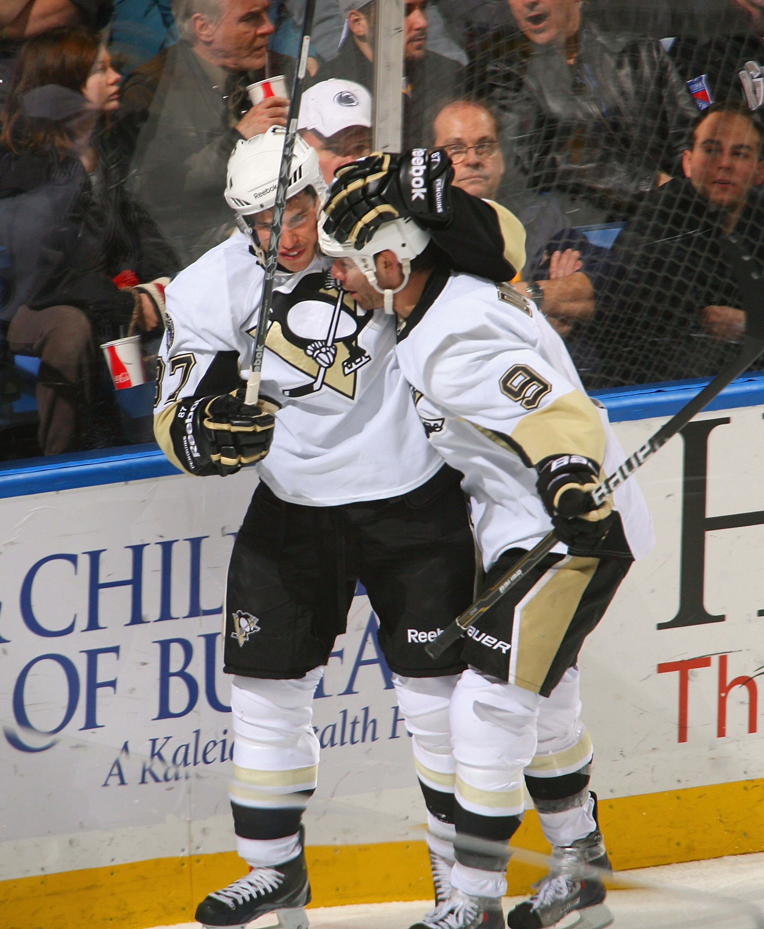 BUFFALO, NY - NOVEMBER 24: Sidney Crosby  #87  and Pascal Dupuis #9 of the Pittsburgh Penguins celebrate Dupuis' goal in the first period against the Buffalo Sabres at HSBC Arena on November 24, 2010 in Buffalo, New York.  (Photo by Rick Stewart/Getty Ima