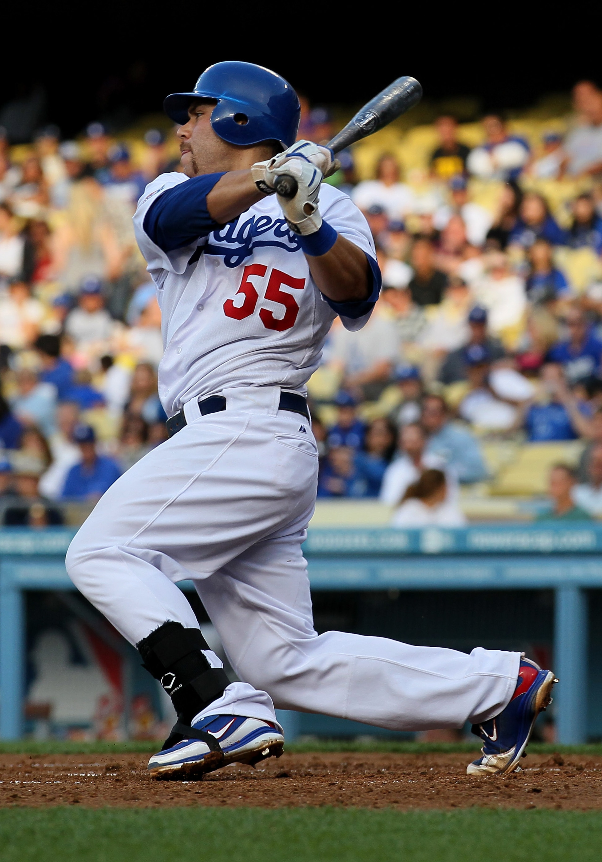 LOS ANGELES, CA - JULY 05: Catcher Russell Martin #55 of the Los Angeles Dodgers gets an RBI single in the second inning against the Florida Marlins on July 5, 2010 at Dodger Stadium in Los Angeles, California. (Photo by Stephen Dunn/Getty Images) LOS ANGELES, CA - JULY 05: Catcher Russell Martin #55 of the Los Angeles Dodgers gets an RBI single in the second inning against the Florida Marlins on July 5, 2010 at Dodger Stadium in Los Angeles, California. (Photo by Stephen Dunn/Getty Images)