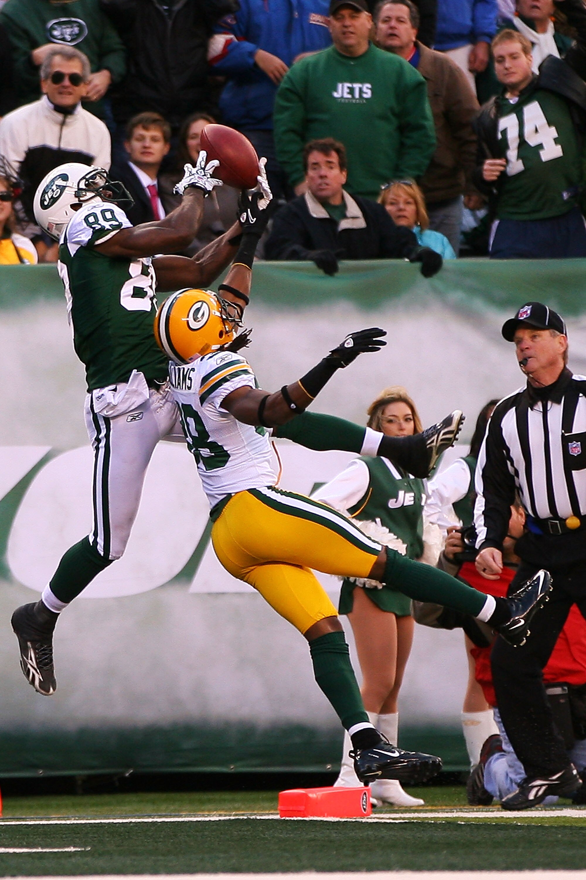 EAST RUTHERFORD, NJ - OCTOBER 31:  Tramon Williams #38 of the Green Bay Packers keeps Jerricho Cotchery #89 of the New York Jets from catching a pass in the end zone during the fourth quarter on October 31, 2010 at the New Meadowlands Stadium in East Ruth