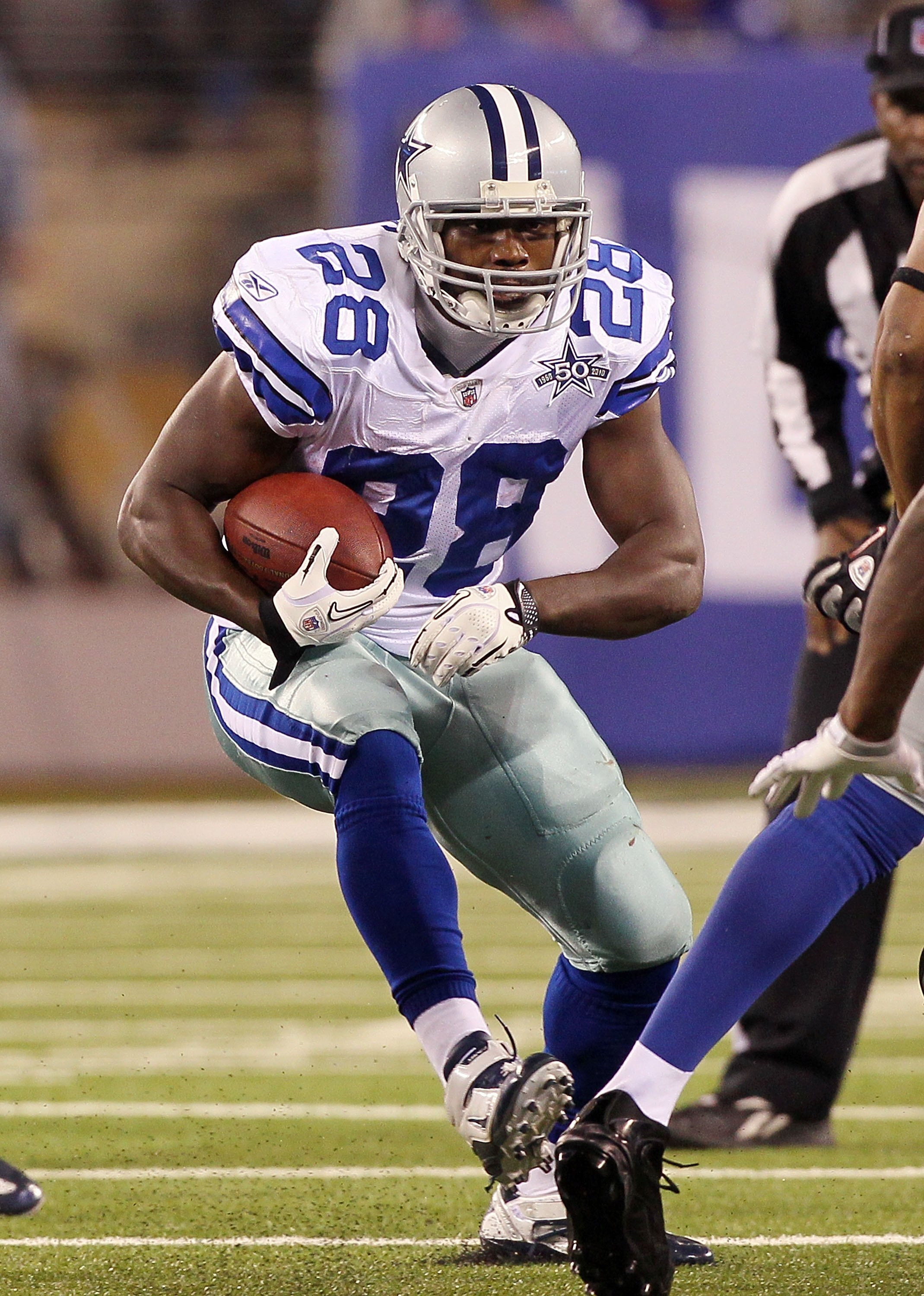 EAST RUTHERFORD, NJ - NOVEMBER 14: Felix Jones #28 of the Dallas Cowboys runs against the New York Giants on November 14, 2010 at the New Meadowlands Stadium in East Rutherford, New Jersey. The Cowboys defeated the Giants 33-20.  (Photo by Jim McIsaac/Get