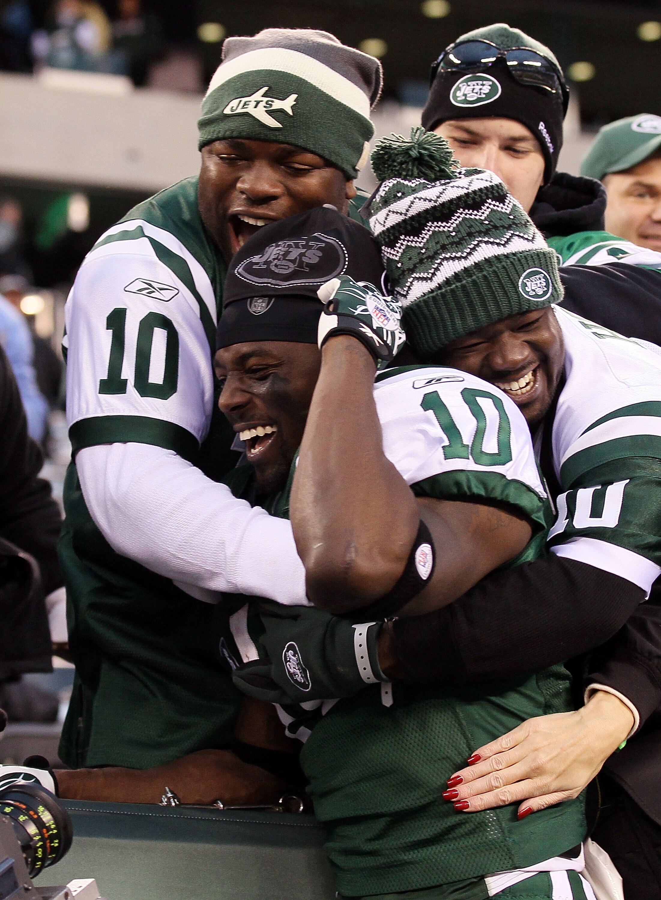 EAST RUTHERFORD, NJ - NOVEMBER 21:  Santonio Holmes #10 of the New York Jets celebrates with fans after defeating the Houston Texans on November 21, 2010 at the New Meadowlands Stadium in East Rutherford, New Jersey. The Jets defeated the Texans 30-27.  (
