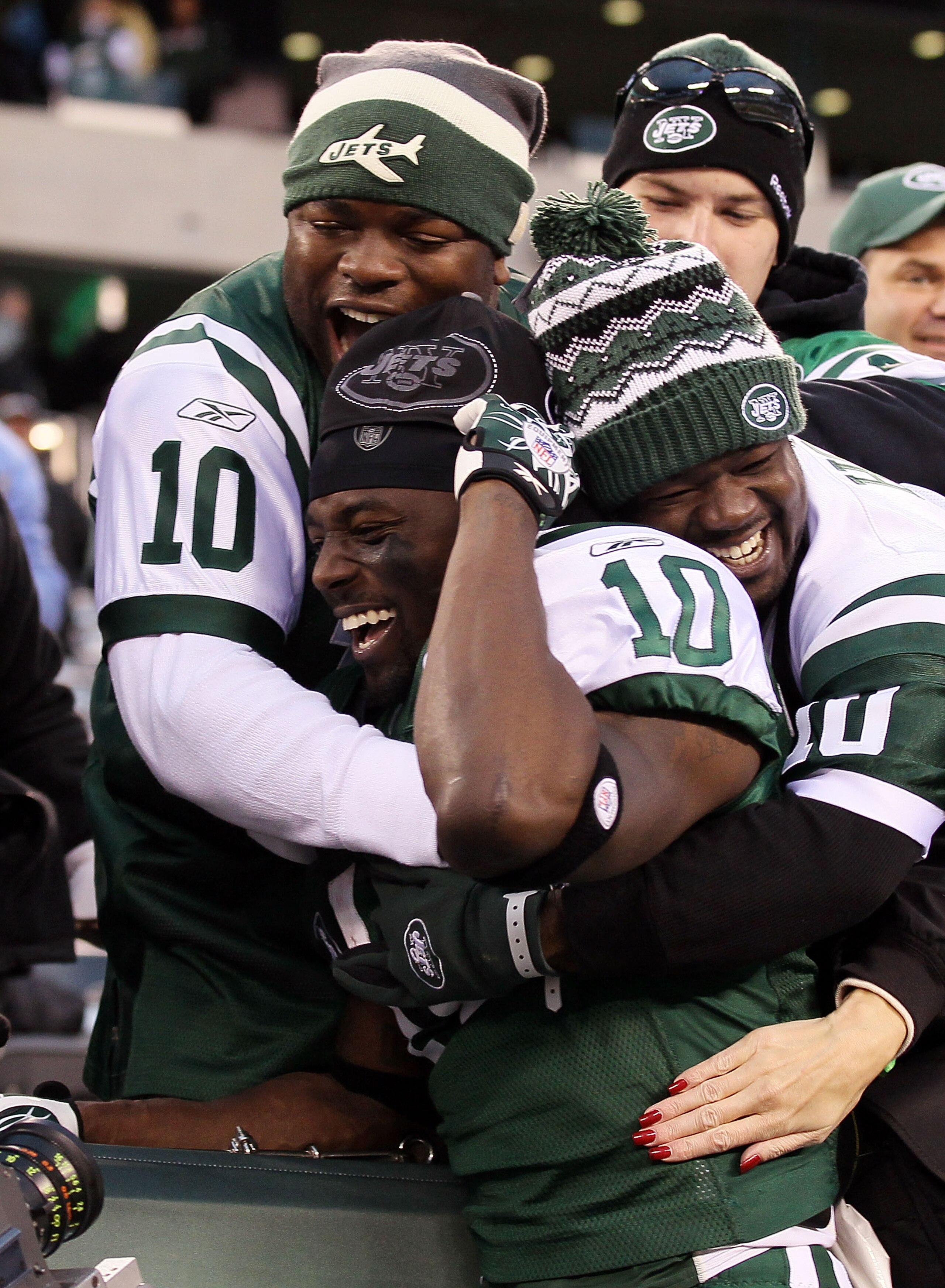 EAST RUTHERFORD, NJ - NOVEMBER 21: Santonio Holmes #10 of the New York Jets celebrates with fans after defeating the Houston Texans on November 21, 2010 at the New Meadowlands Stadium in East Rutherford, New Jersey. The Jets defeated the Texans 30-27. ( EAST RUTHERFORD, NJ - NOVEMBER 21: Santonio Holmes #10 of the New York Jets celebrates with fans after defeating the Houston Texans on November 21, 2010 at the New Meadowlands Stadium in East Rutherford, New Jersey. The Jets defeated the Texans 30-27. (