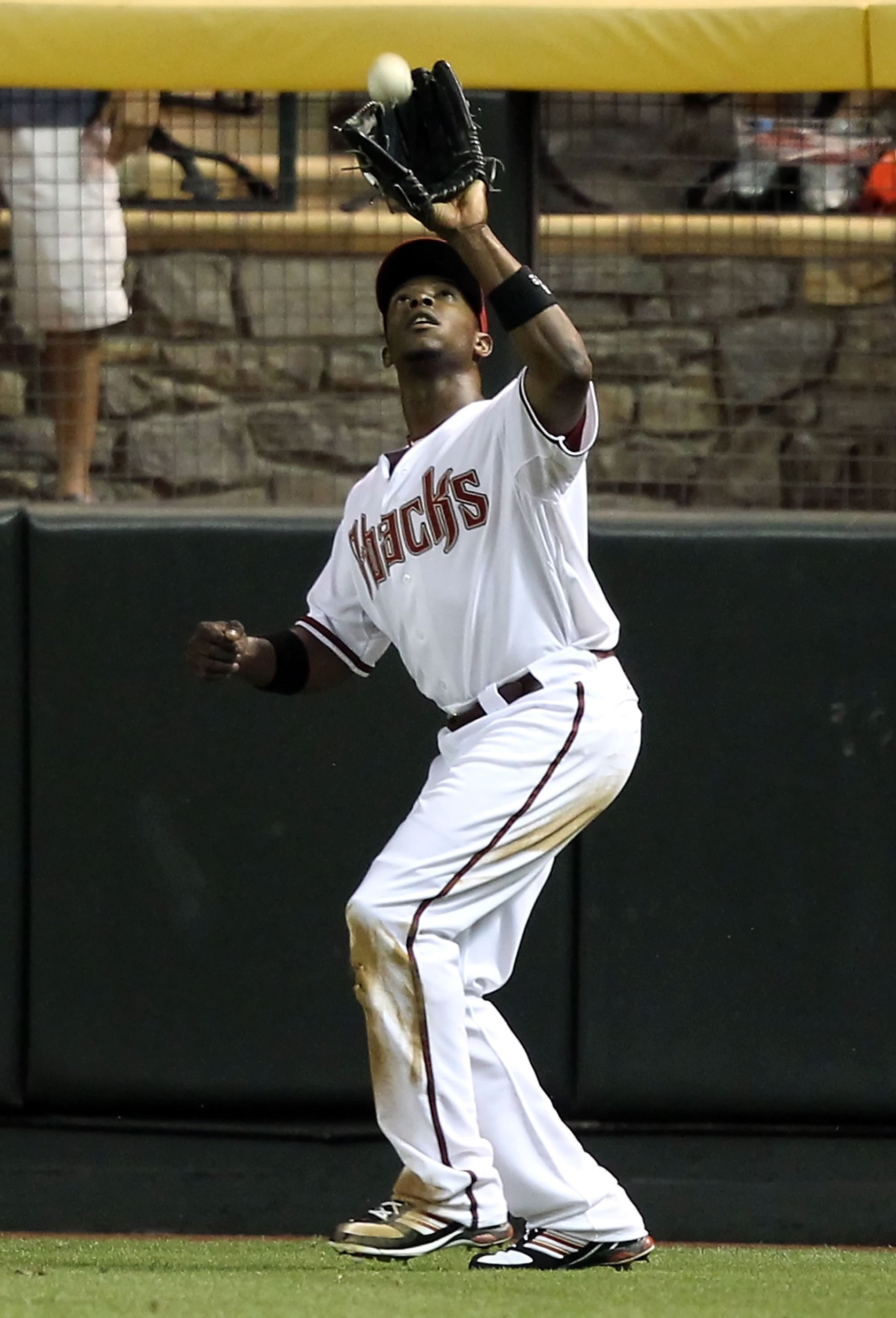 PHOENIX - JUNE 22:  Outfielder Justin Upton #10 of the Arizona Diamondbacks catches a fly ball out during the Major League Baseball game against the New York Yankees at Chase Field on June 22, 2010 in Phoenix, Arizona.   The Yankees defeated the Diamondba