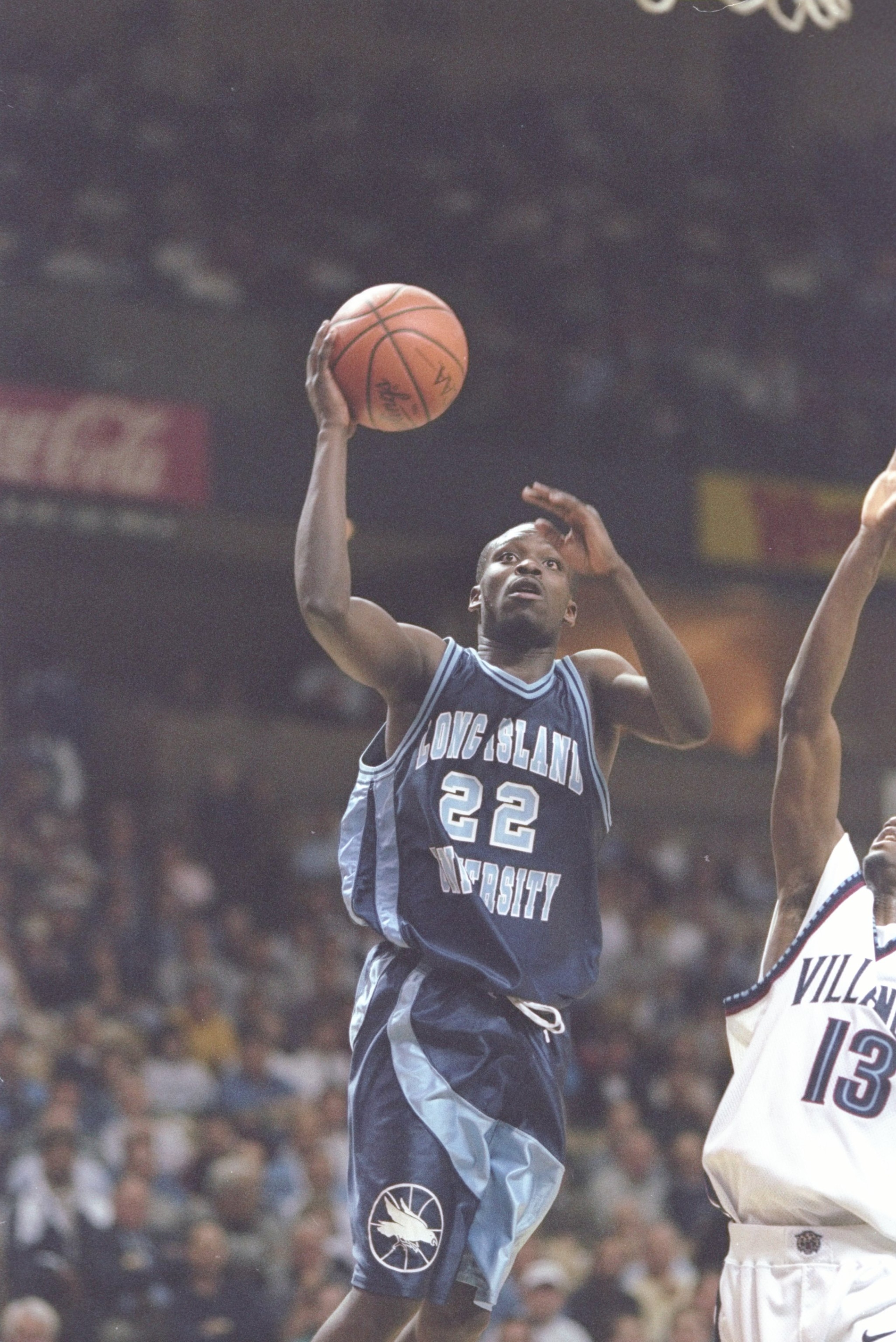 13 Mar 1997: Guard John Celestand of the Villanova Wildcats tries to block shot of the the driving guard Charles Jones of the Long Island Blackbirds during a playoff game at the Lawrence Joel Veteran Memorial Colesium in Winston-Salem, North Carolina. The