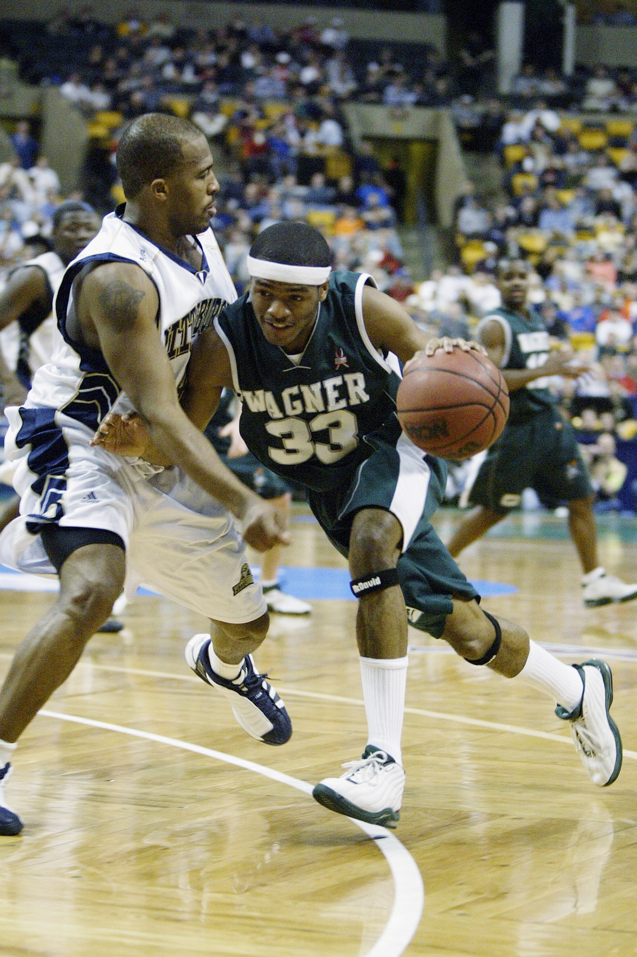 BOSTON - MARCH 21:  Teoine Carroll #33 of the Wagner Seahawks drives against the University of Pittsburgh Panthers during the first round of the NCAA Tournament on March 21, 2003 at the FleetCenter in Boston, Massachusetts.  Pittsburgh defeated Wagner 87-
