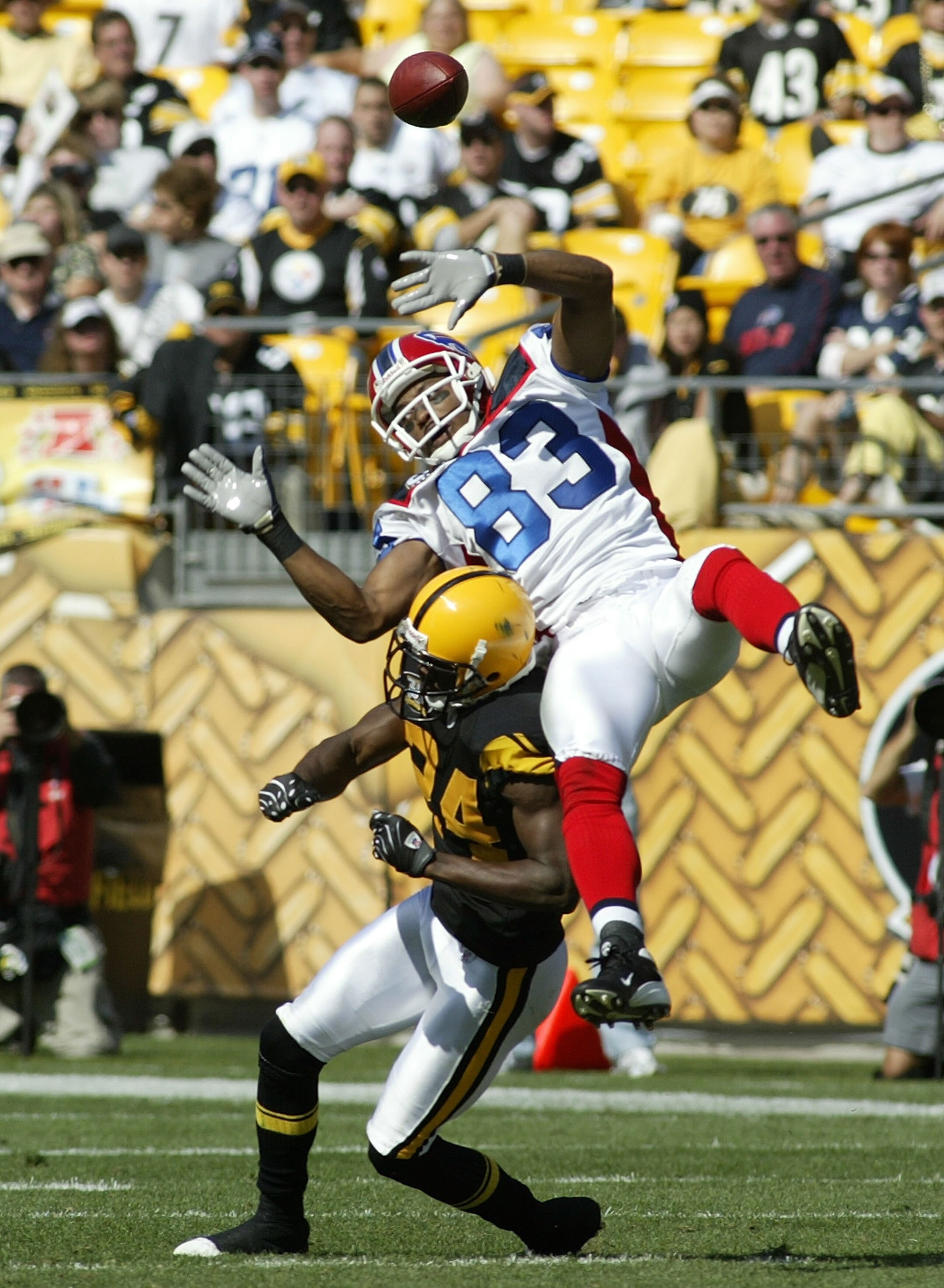 PITTSBURGH - SEPTEMBER 16: Lee Evans #83 of the Buffalo Bills is hit by Ike Taylor #24 of the Pittsburgh Steelers at Heinz Field September 16, 2007 in Pittsburgh, Pennsylvania. Pittsburgh won 26-3. (Photo by Rick Stewart/Getty Images) PITTSBURGH - SEPTEMBER 16: Lee Evans #83 of the Buffalo Bills is hit by Ike Taylor #24 of the Pittsburgh Steelers at Heinz Field September 16, 2007 in Pittsburgh, Pennsylvania. Pittsburgh won 26-3. (Photo by Rick Stewart/Getty Images)