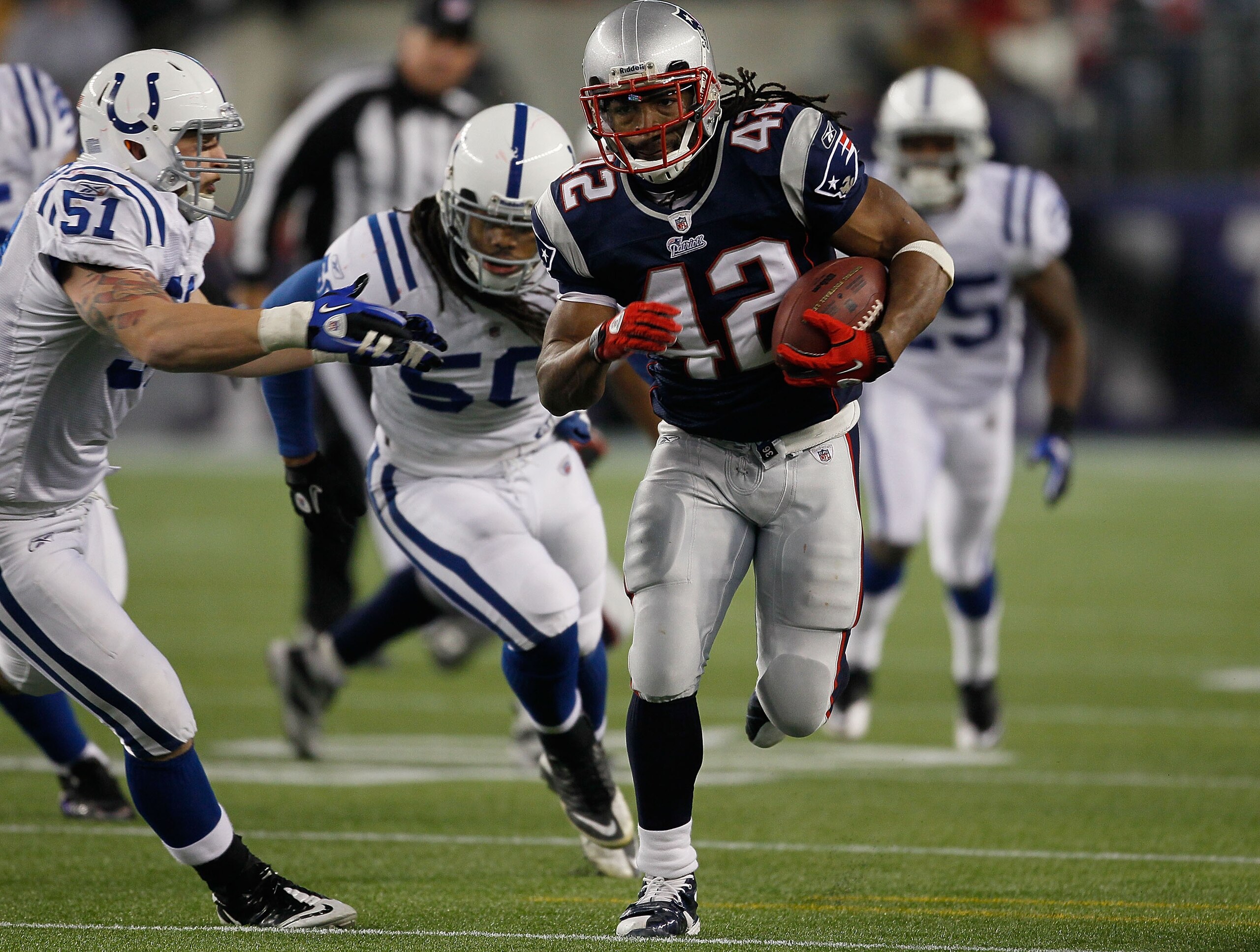FOXBORO, MA - NOVEMBER 21:  BenJarvus Green-Ellis #42 of the New England Patriots gains yards against the defense Pat Angerer #51 and Philip Wheeler #50 of the Indianapolis Colts in the second half at Gillette Stadium on November 21, 2010 in Foxboro, Mass