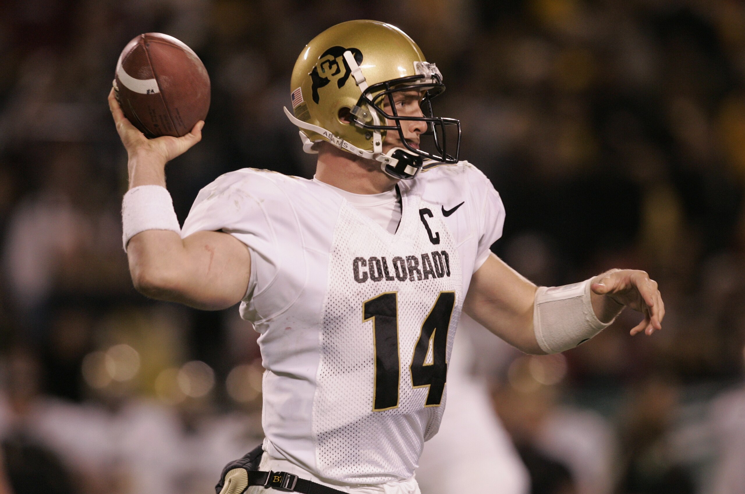 KANSAS CITY, MO - DECEMBER 4:  Joel Klatt #14 of the University of Colorado Buffaloes passes against the University of Oklahoma Sooners in the Big 12 Championship game on December 4, 2004 at Arrowhead Stadium in Kansas City, Missouri.  Oklahoma defeated C