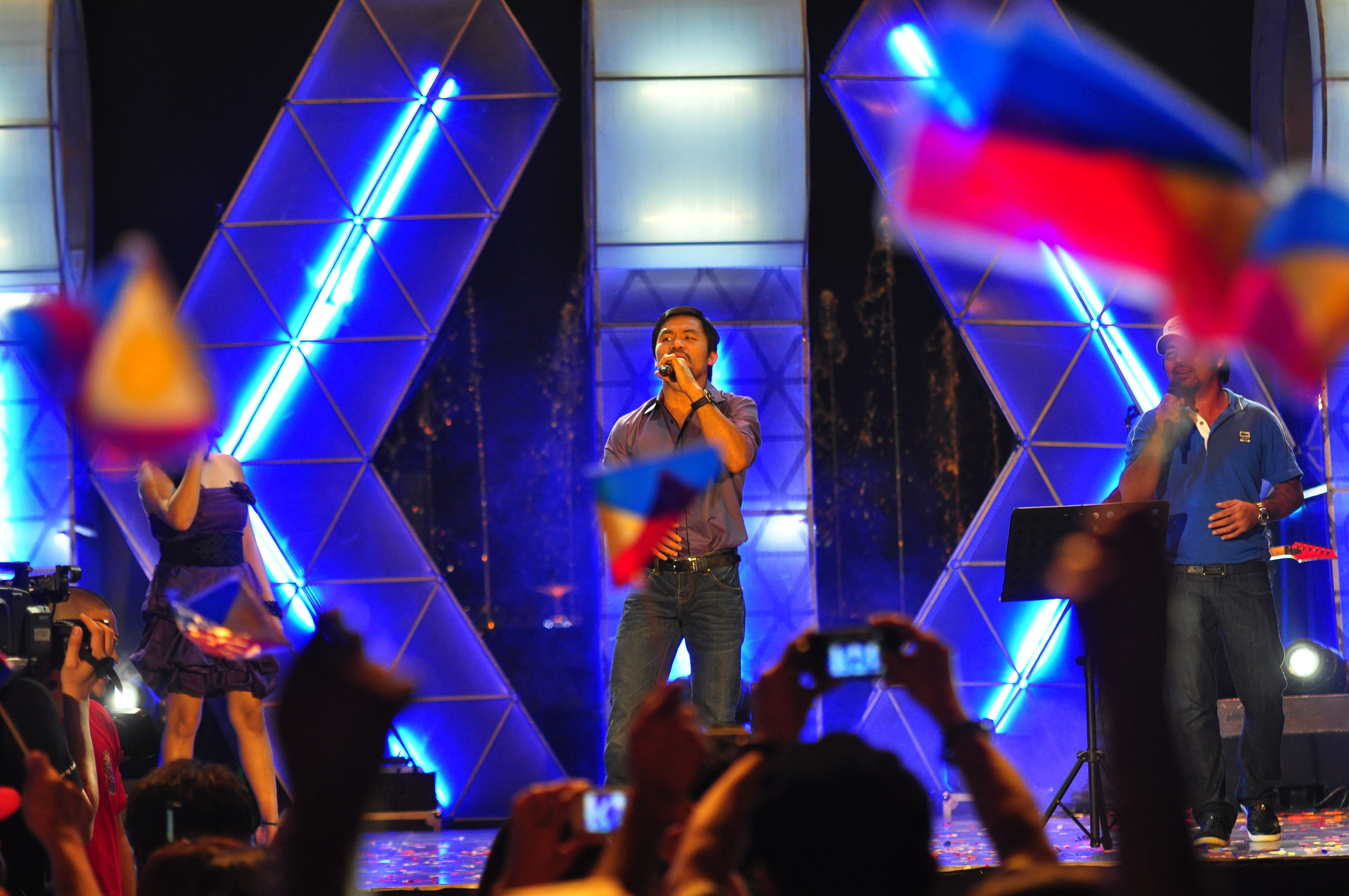 MANILA, PHILIPPINES - NOVEMBER 20:  Boxer and congressman, Manny Pacquiao performs with his band during a concert in Manila following his win of the WBC super welterweight crown against Mexican Antonio Margarito on November 20, 2010 in Manila, Philippines