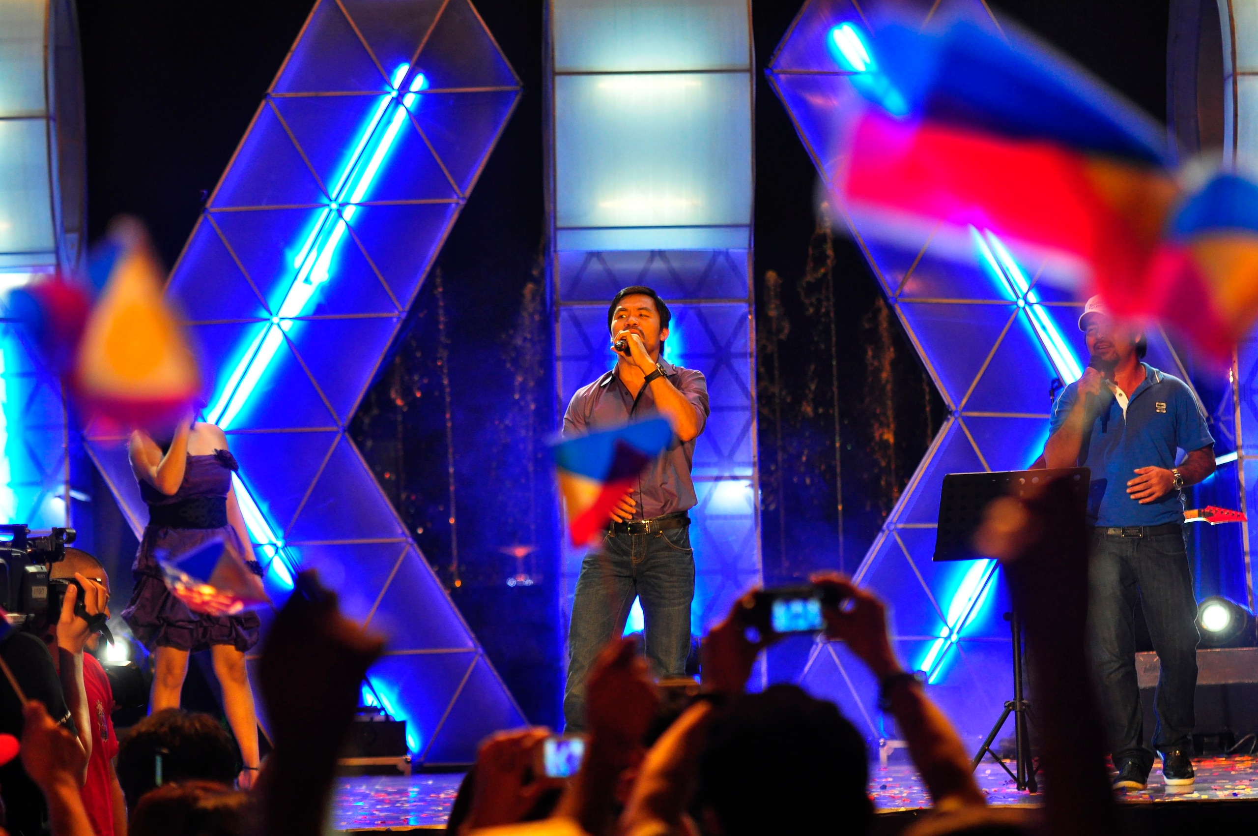 MANILA, PHILIPPINES - NOVEMBER 20:  Boxer and congressman, Manny Pacquiao performs with his band during a concert in Manila following his win of the WBC super welterweight crown against Mexican Antonio Margarito on November 20, 2010 in Manila, Philippines