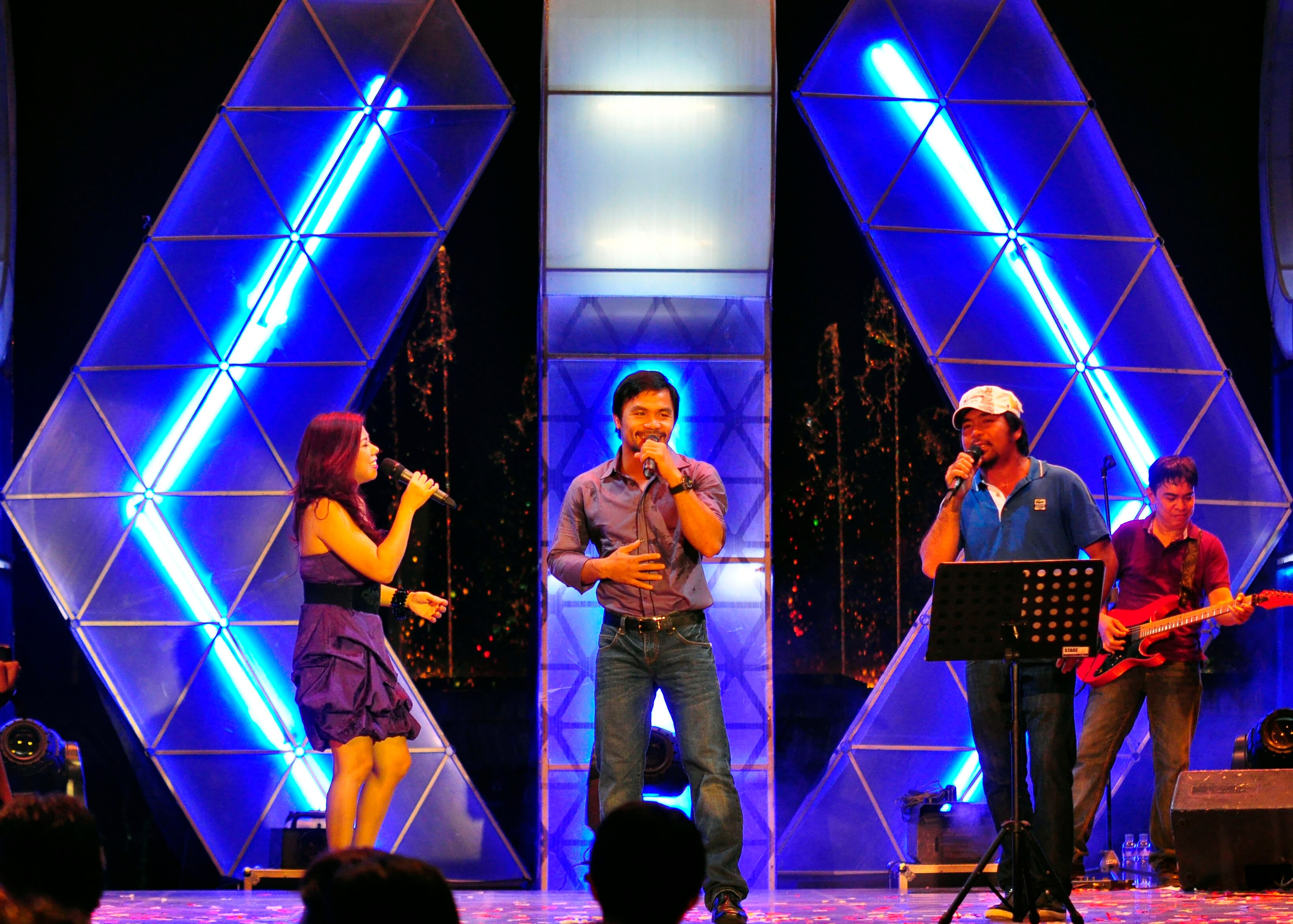 MANILA, PHILIPPINES - NOVEMBER 20:  Boxer and congressman, Manny Pacquiao performs with his band during a concert in Manila following his win of the WBC super welterweight crown against Mexican Antonio Margarito on November 20, 2010 in Manila, Philippines