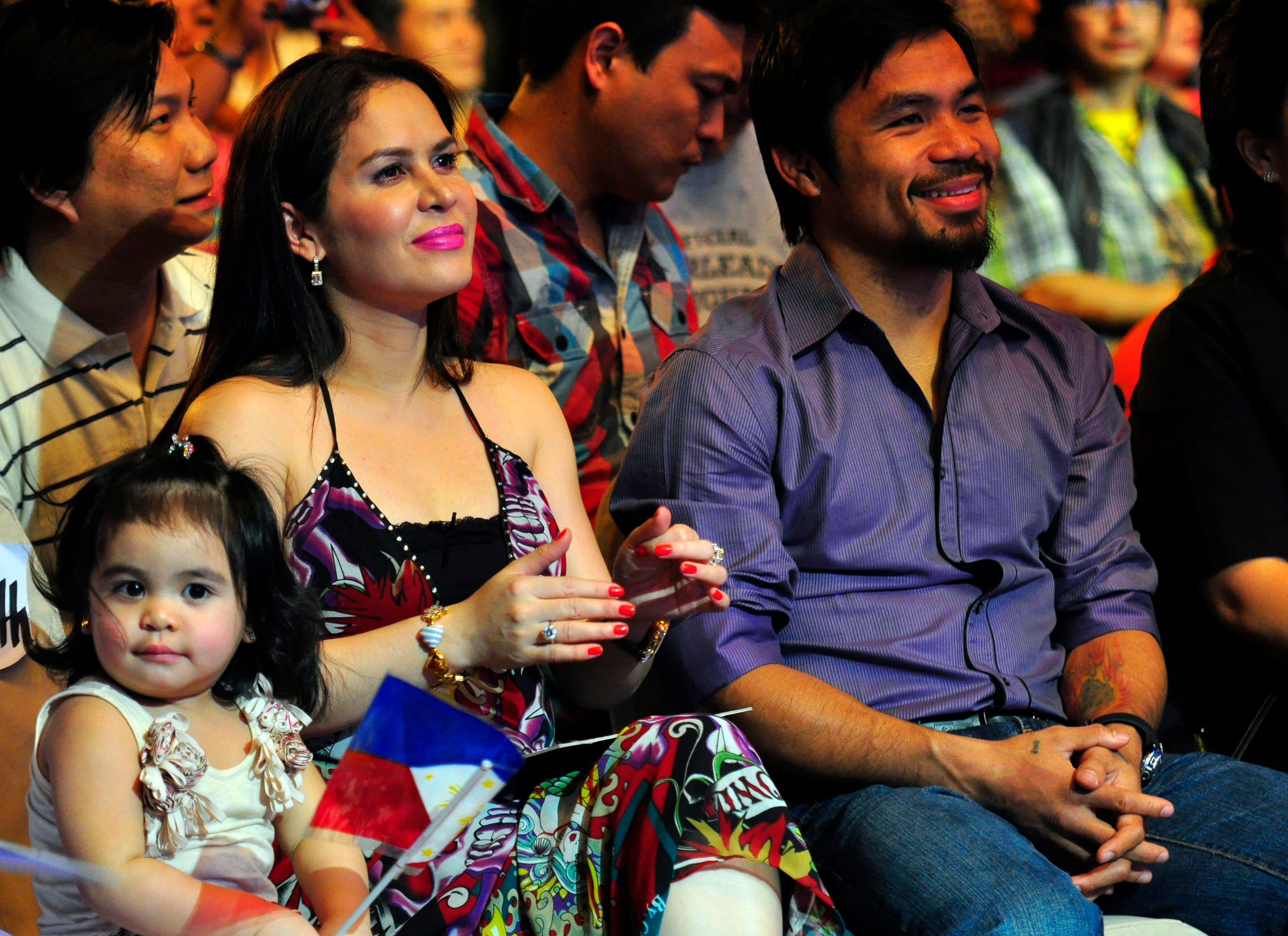 MANILA, PHILIPPINES - NOVEMBER 20:  Boxer and congressman, Manny Pacquiao attends his concert in Manila with wife Jinky and youngest daughter Qeen Elizabeth following his win of the WBC super welterweight crown against Mexican Antonio Margarito on Novembe