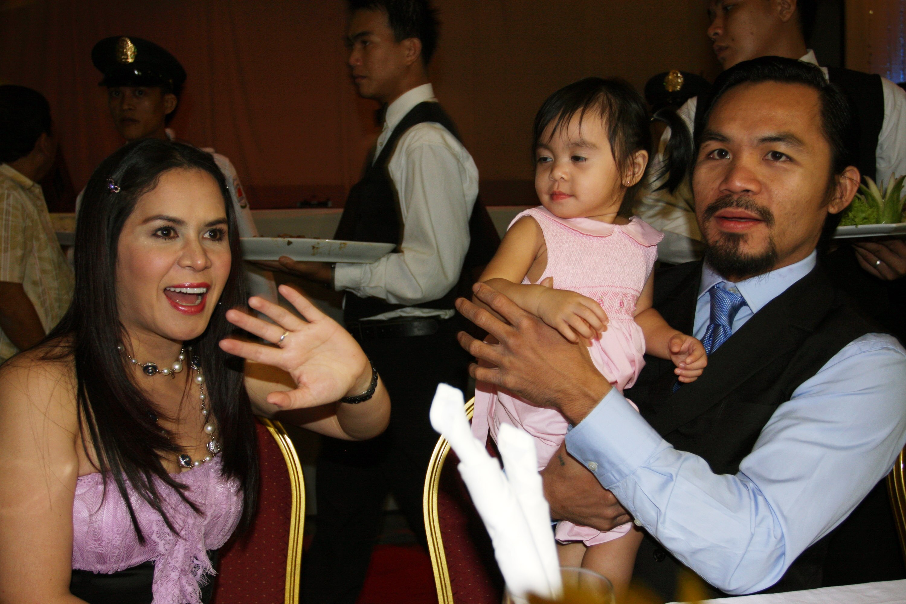 GENERAL SANTOS, PHILIPPINES - MAY 15:  (R-L) World welterweight boxing champion Manny Pacquiao is seen with his daughter Queen Pacquiao and wife Jinkee Pacquiao at the KCC Mall on May 15, 2010 in General Santos, Philippines. Pacquiao was there to celebrat