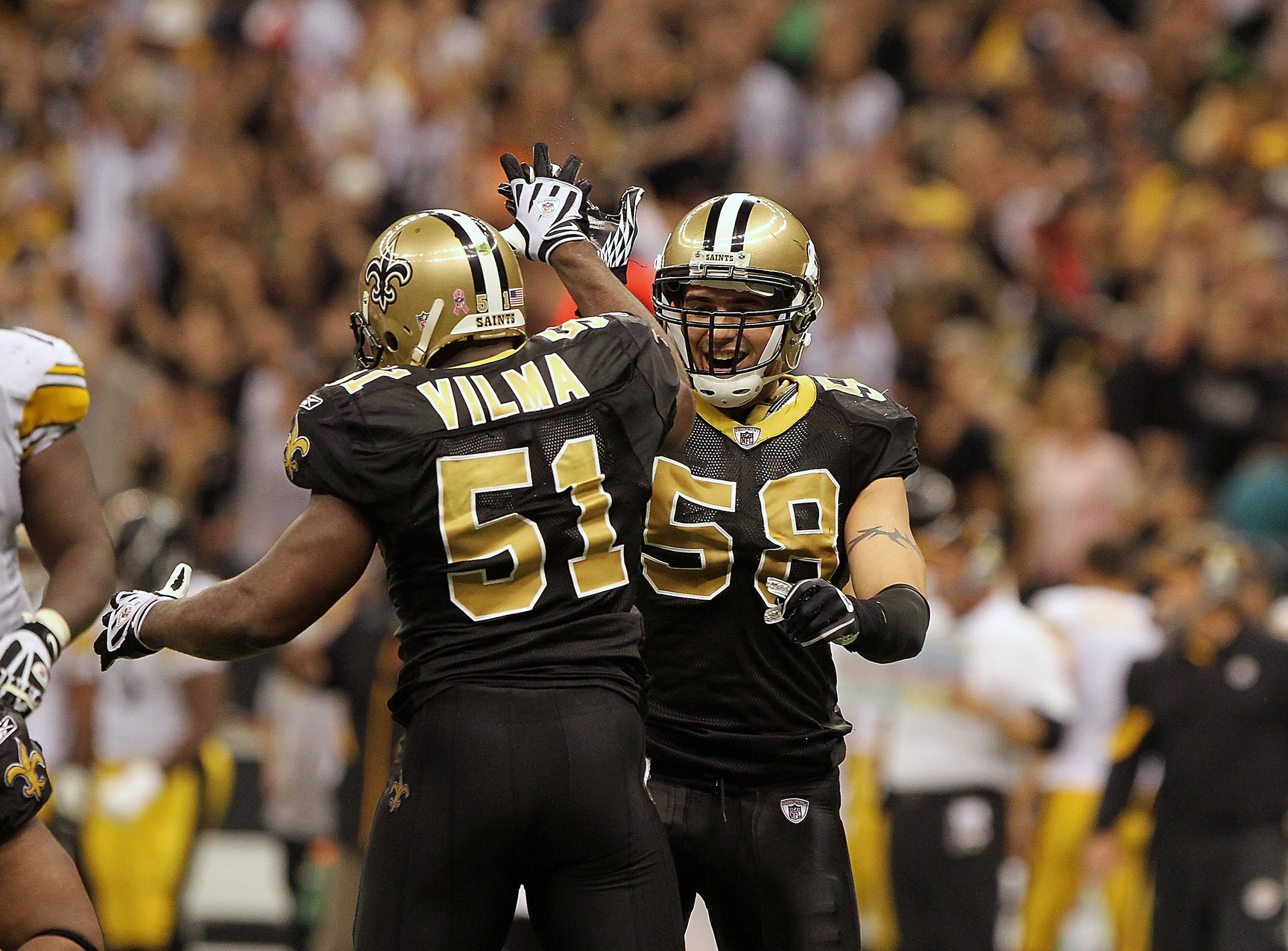 NEW ORLEANS, LA - OCTOBER 31: Scott Shanle #58 and Jonathan Vilma #51 of the New Orleans Saints celebrate a play during the game against the Pittsburgh Steelers at the Louisiana Superdome on October 31, 2010 in New Orleans, Louisiana. (Photo by Matthew Sh