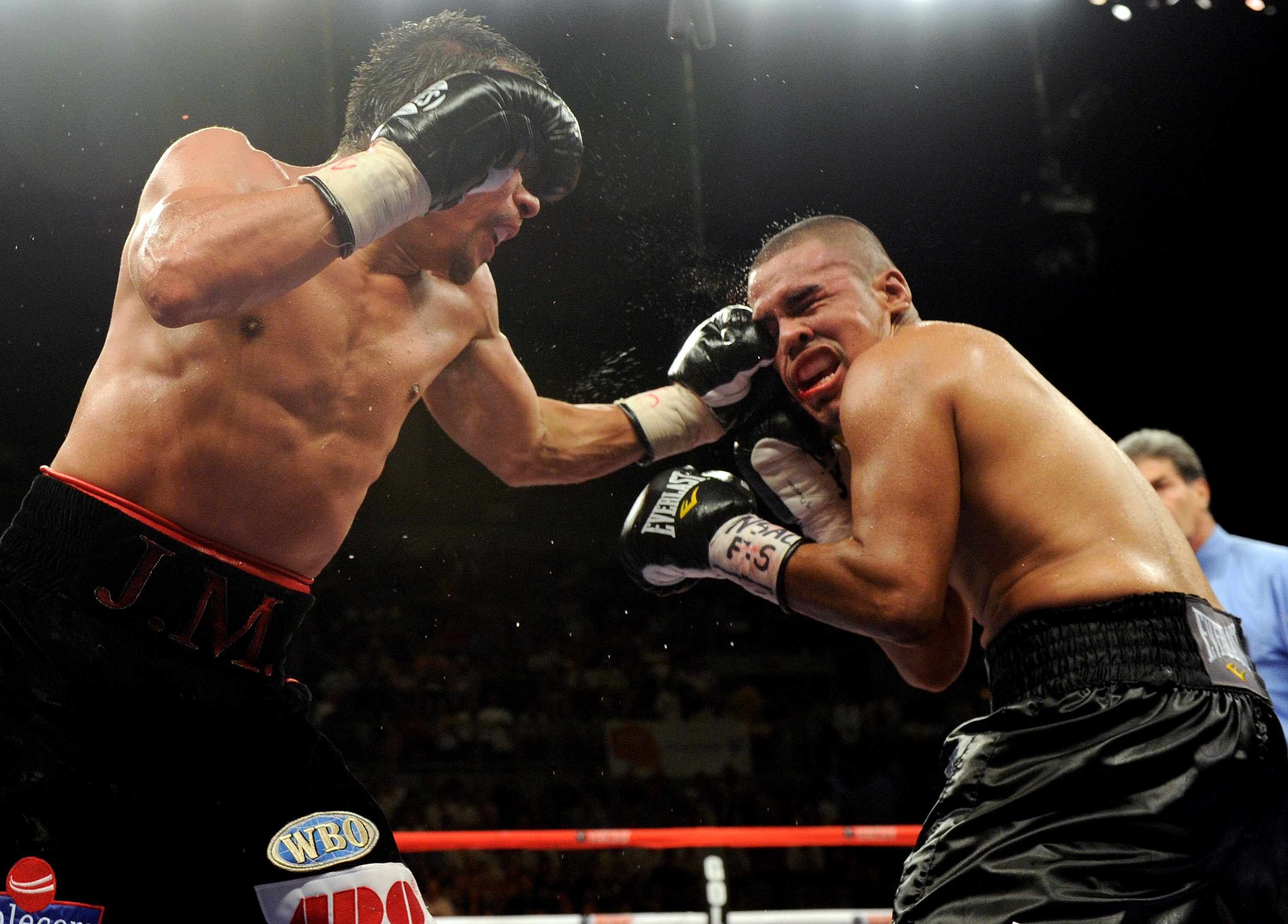 LAS VEGAS - JULY 31:  WBA/WBO lightweight champion Juan Manuel Marquez (L) hits Juan Diaz in the 11th round of their bout at the Mandalay Bay Events Center July 31, 2010 in Las Vegas, Nevada. Marquez retained his WBA and WBO lightweight championship belts