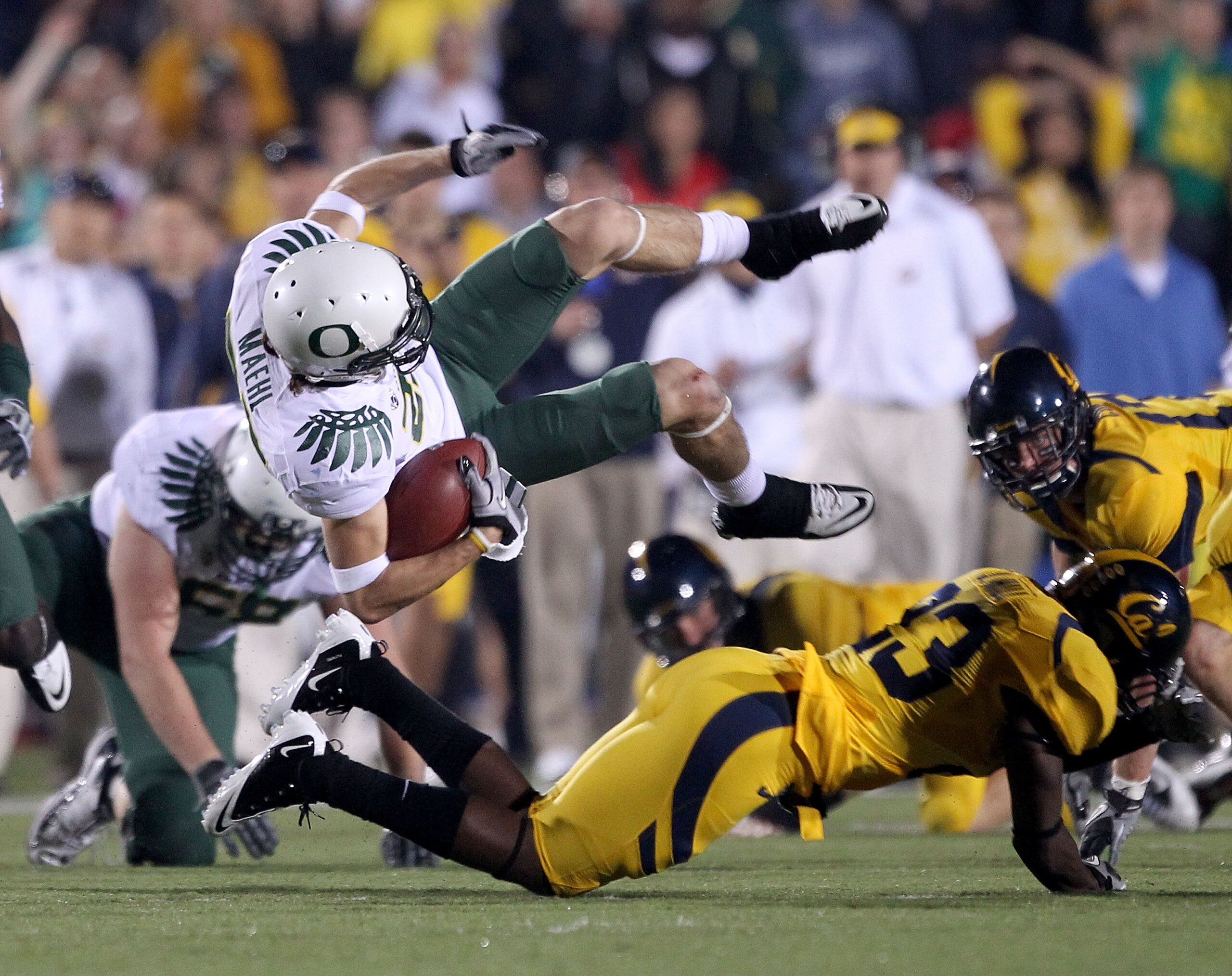 BERKELEY, CA - NOVEMBER 13: Jeff Maehl #23 of the Oregon Ducks flies through the air after being hit by Josh Hill #23 of the California Golden Bears at California Memorial Stadium on November 13, 2010 in Berkeley, California. (Photo by Ezra Shaw/Getty BERKELEY, CA - NOVEMBER 13: Jeff Maehl #23 of the Oregon Ducks flies through the air after being hit by Josh Hill #23 of the California Golden Bears at California Memorial Stadium on November 13, 2010 in Berkeley, California. (Photo by Ezra Shaw/Getty