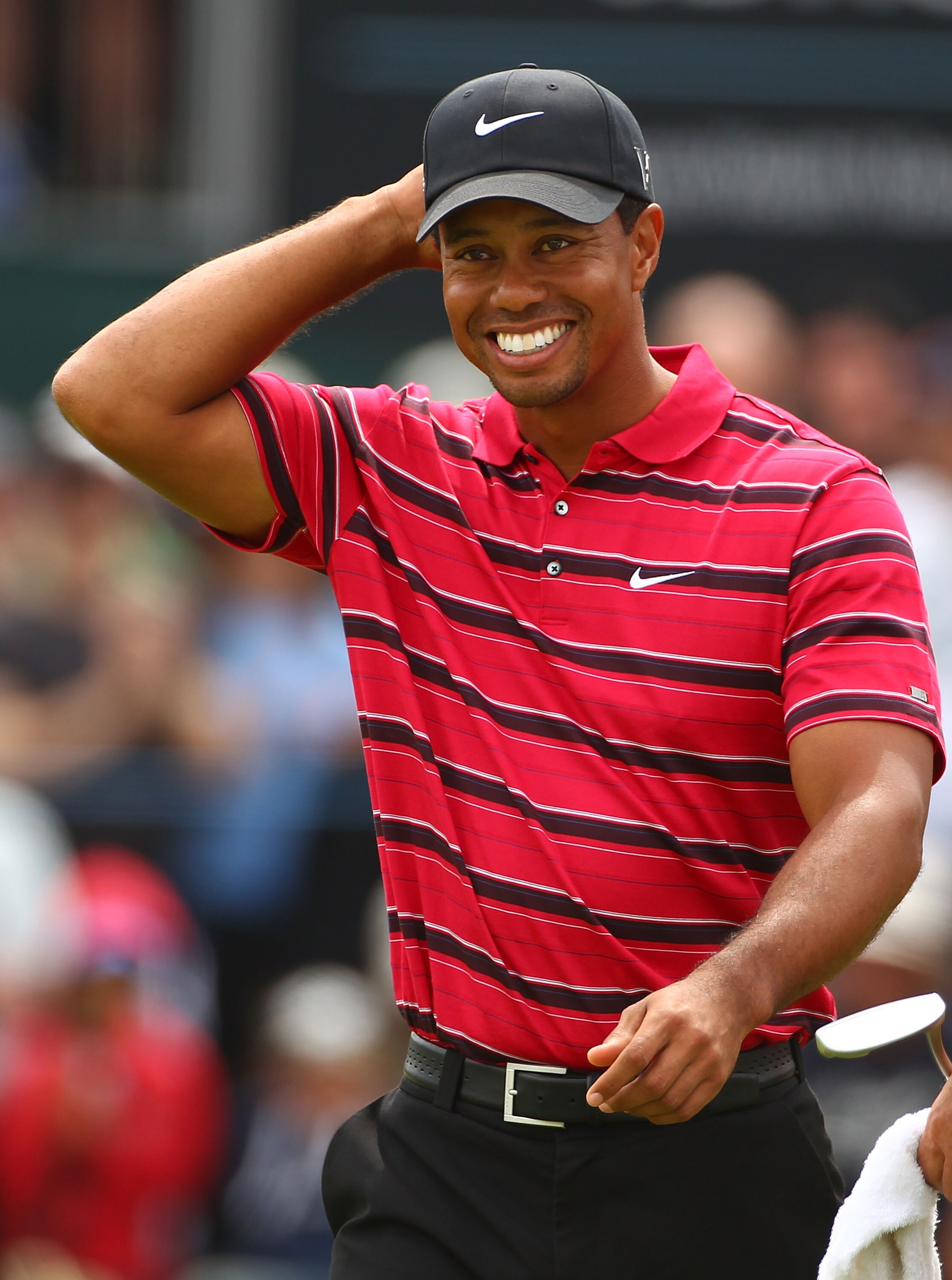 MELBOURNE, AUSTRALIA - NOVEMBER 14:  Tiger Woods of the USA acknowledges the crowd as he walks off the 18th hole during day four of the Australian Masters at The Victoria Golf Club on November 14, 2010 in Melbourne, Australia.  (Photo by Robert Cianflone/